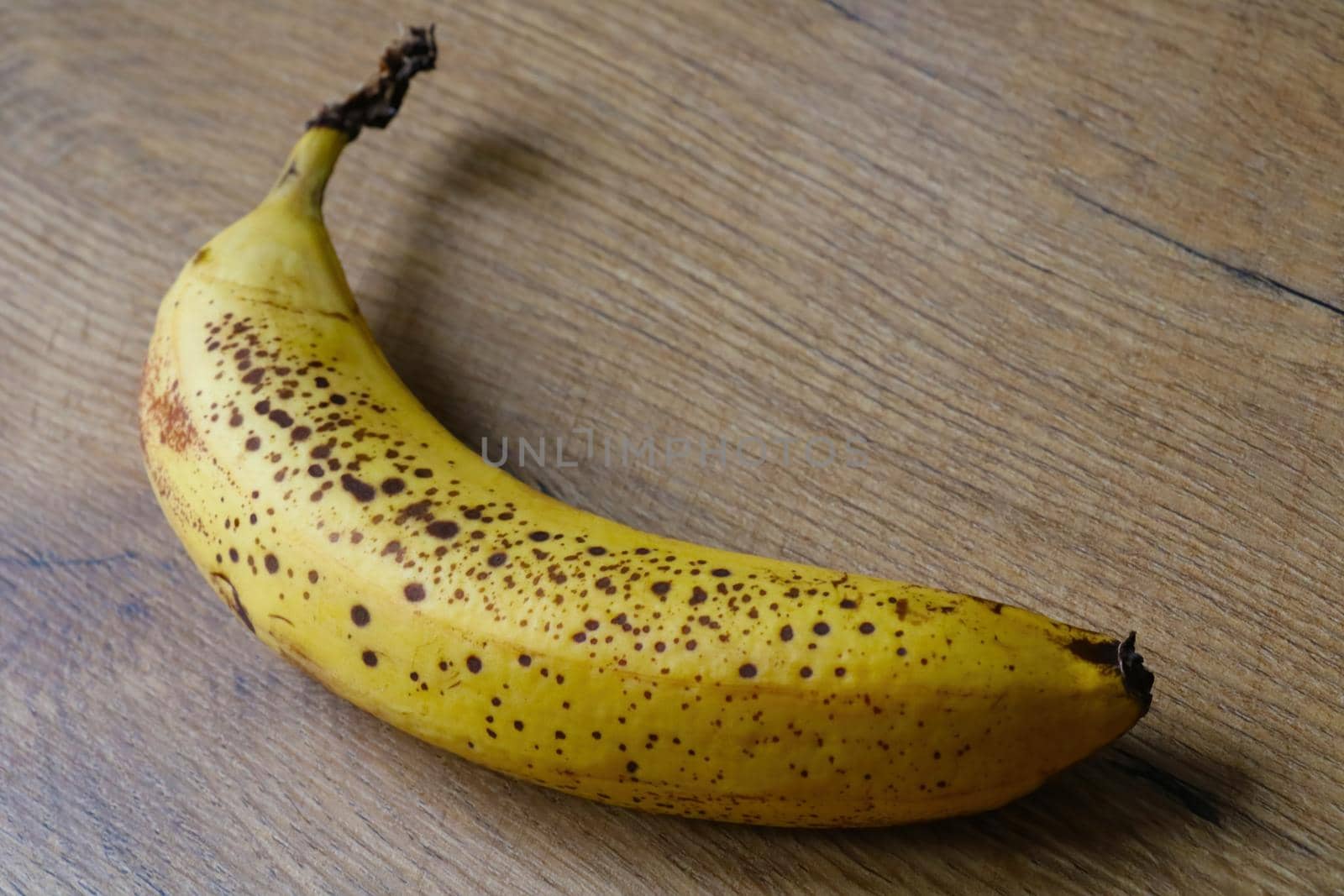 Close-up on a yellow banana on the table