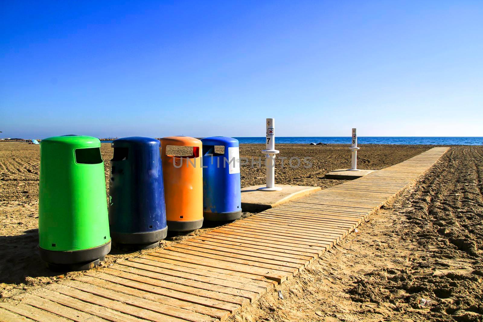 Colorful Recycling bins on the beach in Santa Pola, Alicante