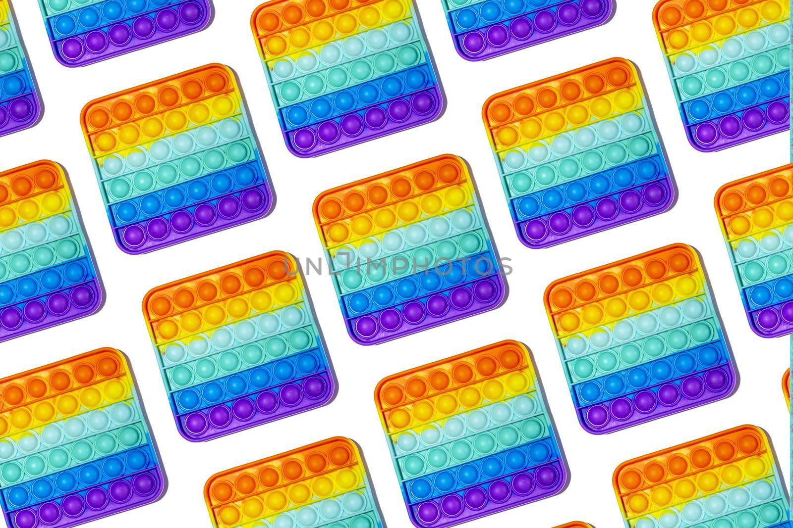 Pattern Colorful pop it toys close up. Isolate on white background. by Essffes