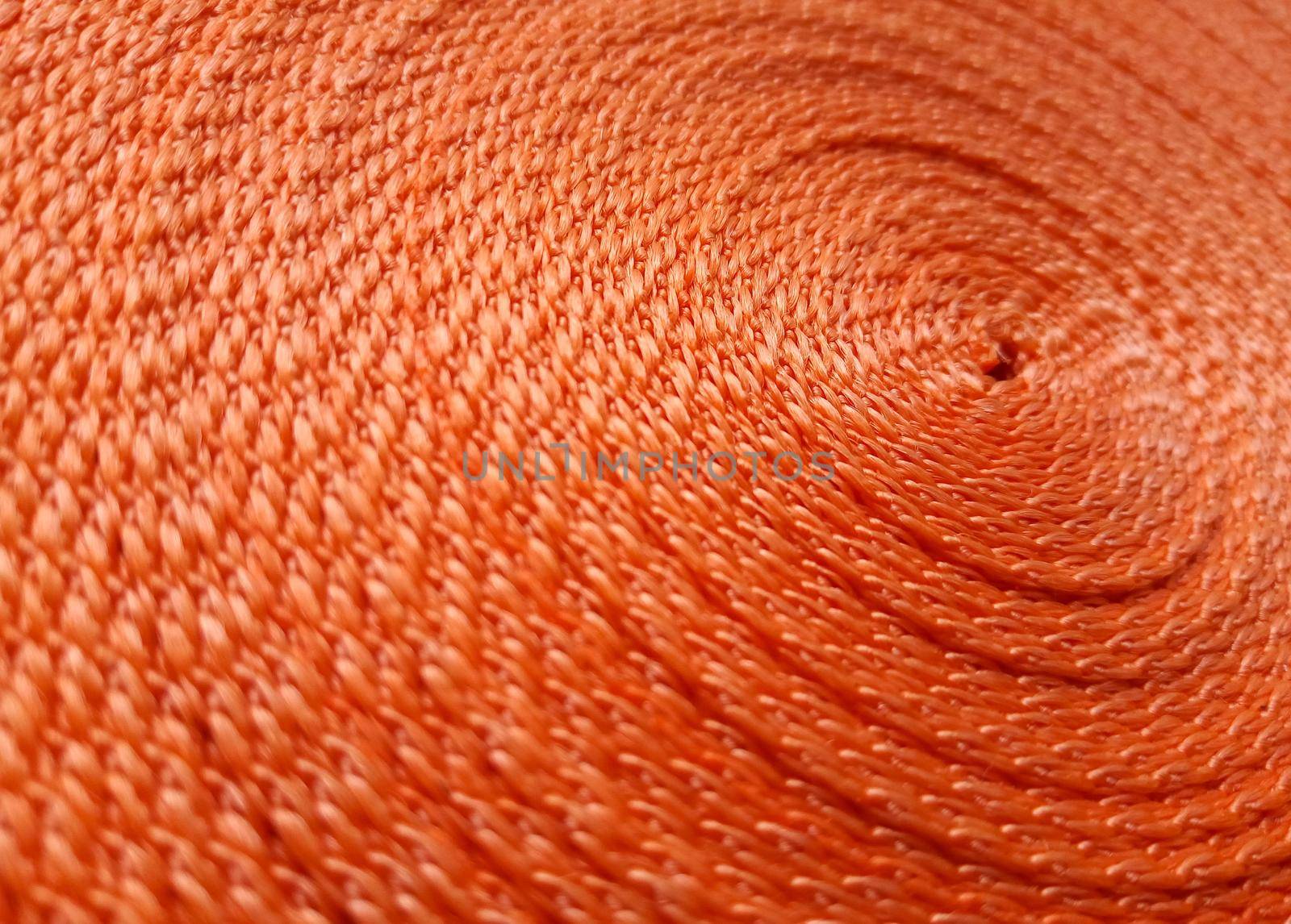 Orange abstract background. Circular pattern of orange sling.