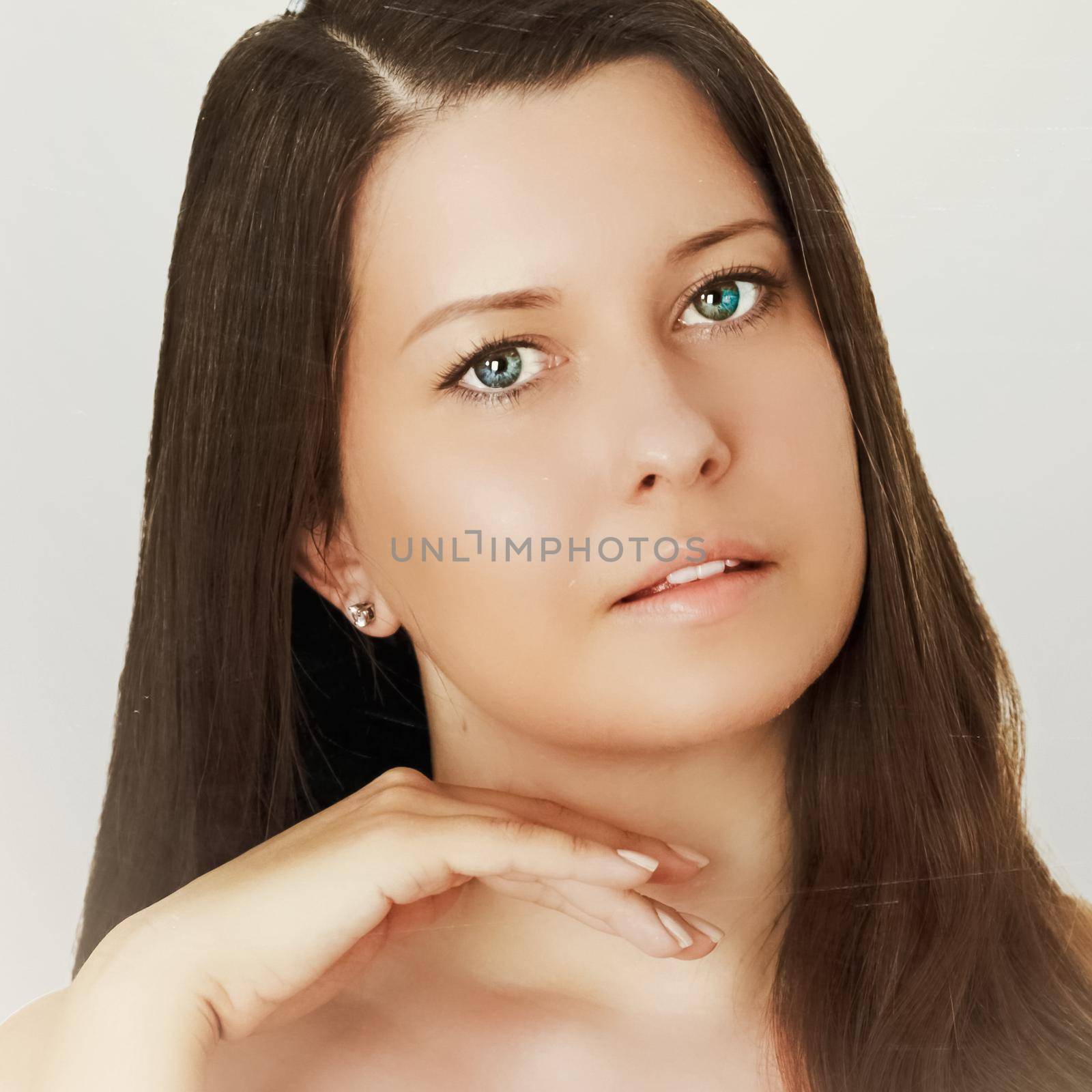 Suntan skin tone and beauty routine. Beautiful brunette female model with natural tan, face portrait of young woman by Anneleven