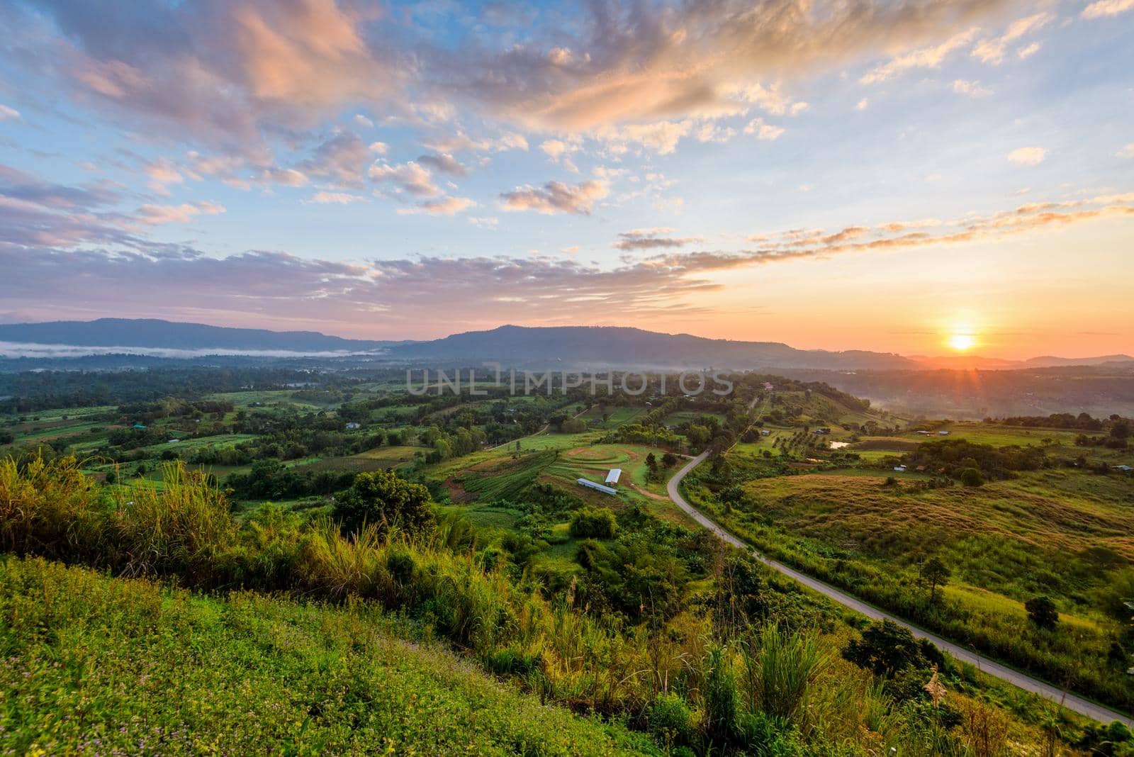 Beautiful nature landscape of the colorful sky and mountains during the sunrise at Khao Takhian Ngo View Point, Khao Kho attractions in Phetchabun, Thailand