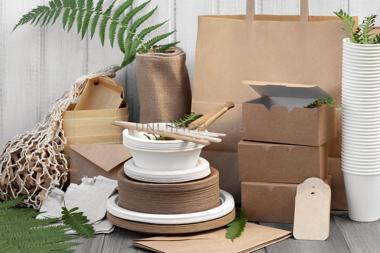 Eco friendly packaging and dishes made from natural recyclable materials. Environmental protection and waste reduction concept.