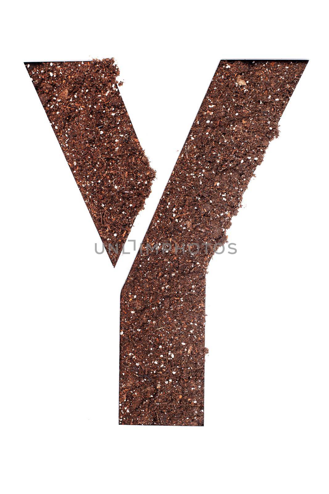 stencil letter Y made above dirt on white surface by kokimk