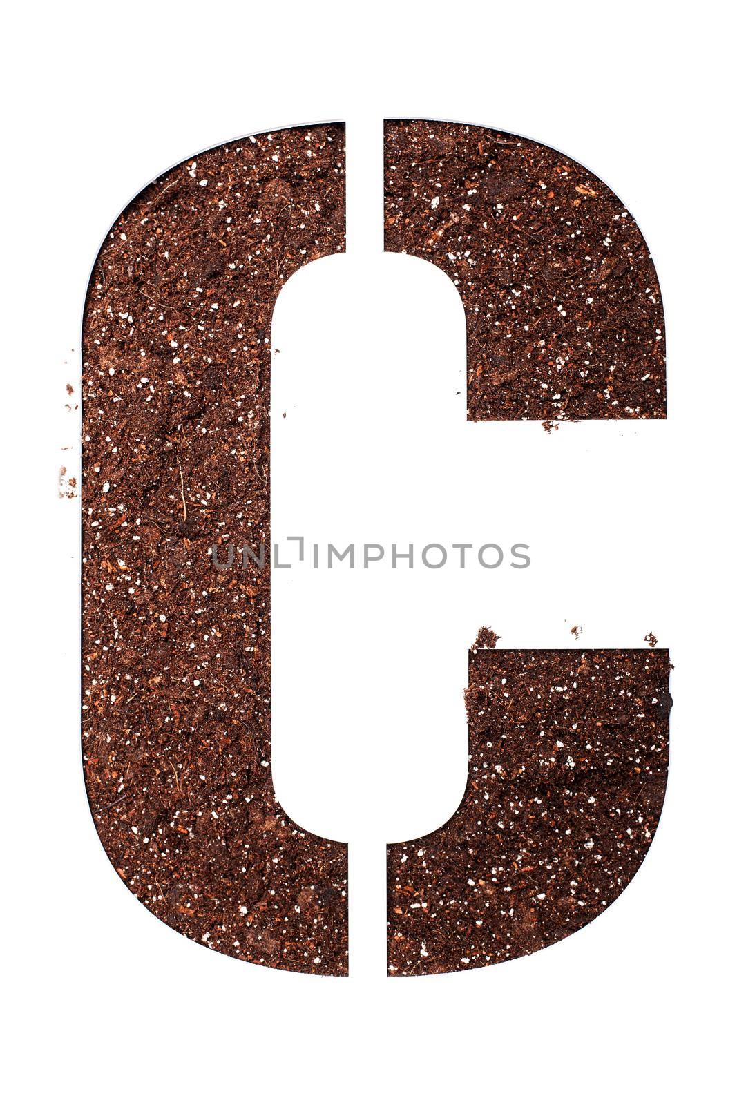 stencil letter C made above dirt on white surface by kokimk