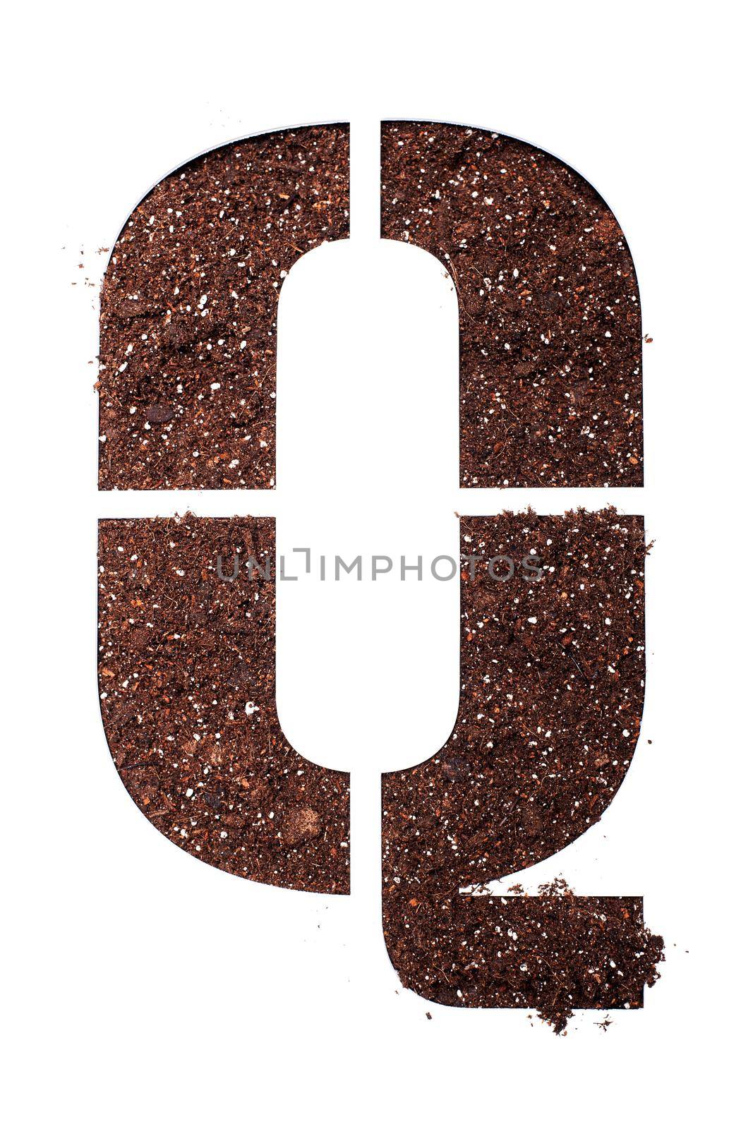 stencil letter Q made above dirt on white surface by kokimk