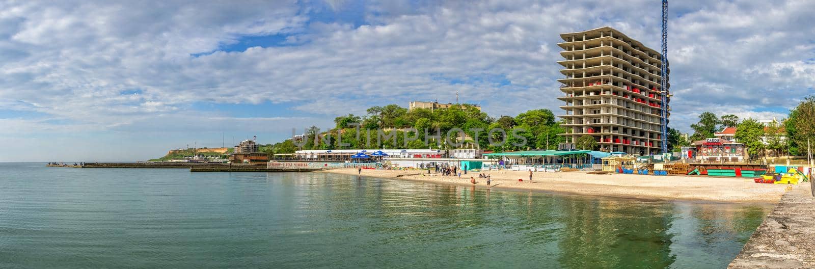 01.06.2021. Illegal construction of a residential building on the public beach Zolotoy Bereg in Odessa, Ukraine, on a sunny summer morning