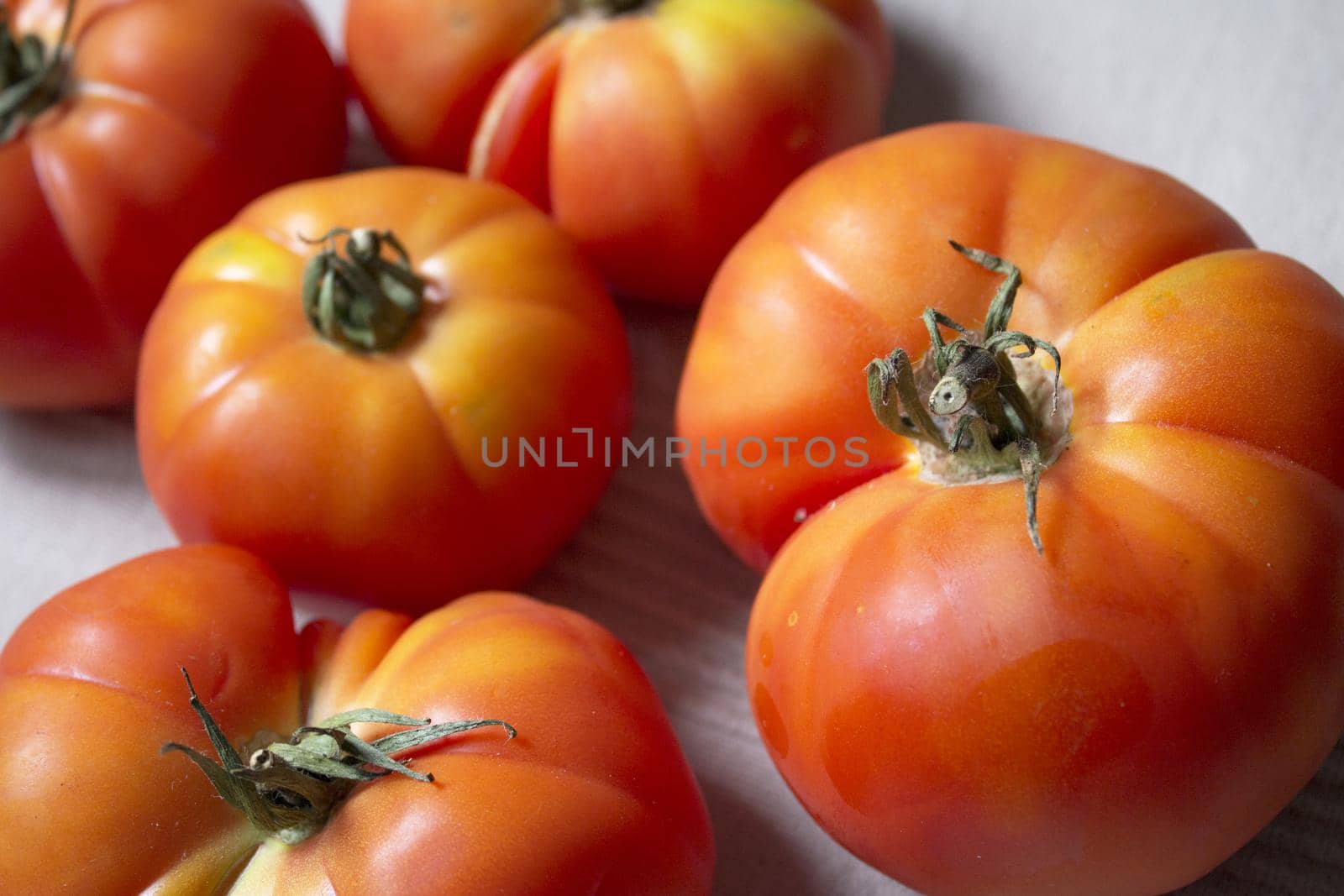 Group of uncooked raw red tomatoes. Raw food