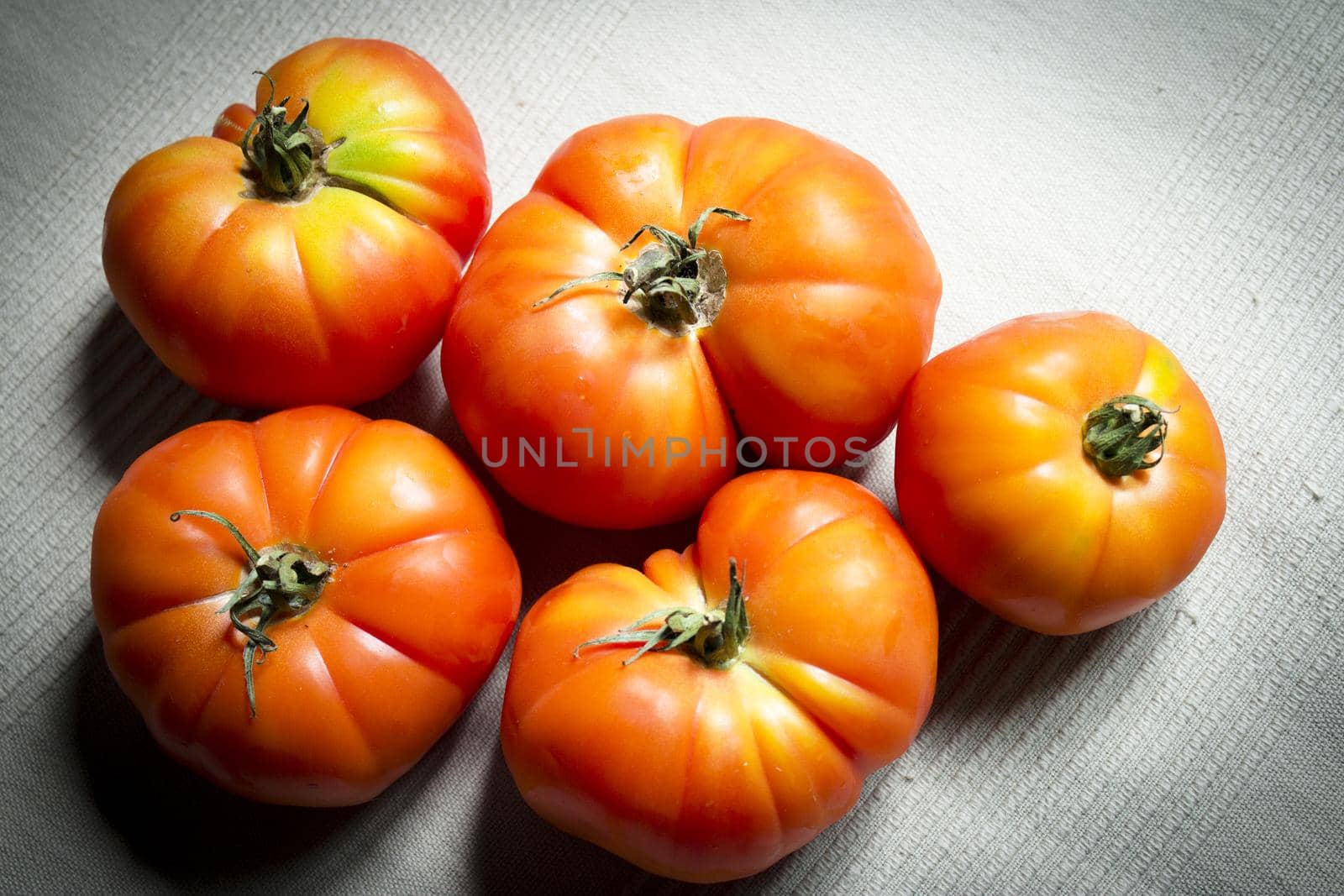 Group of uncooked raw red tomatoes. Raw food