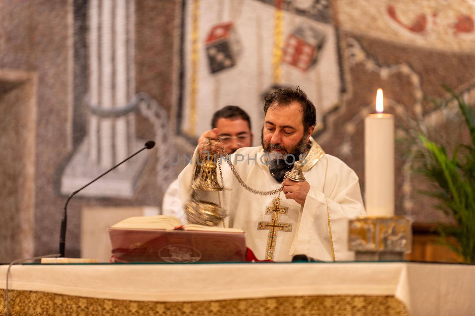 priests during the holy mass in the church of sacro cuore terni by carfedeph