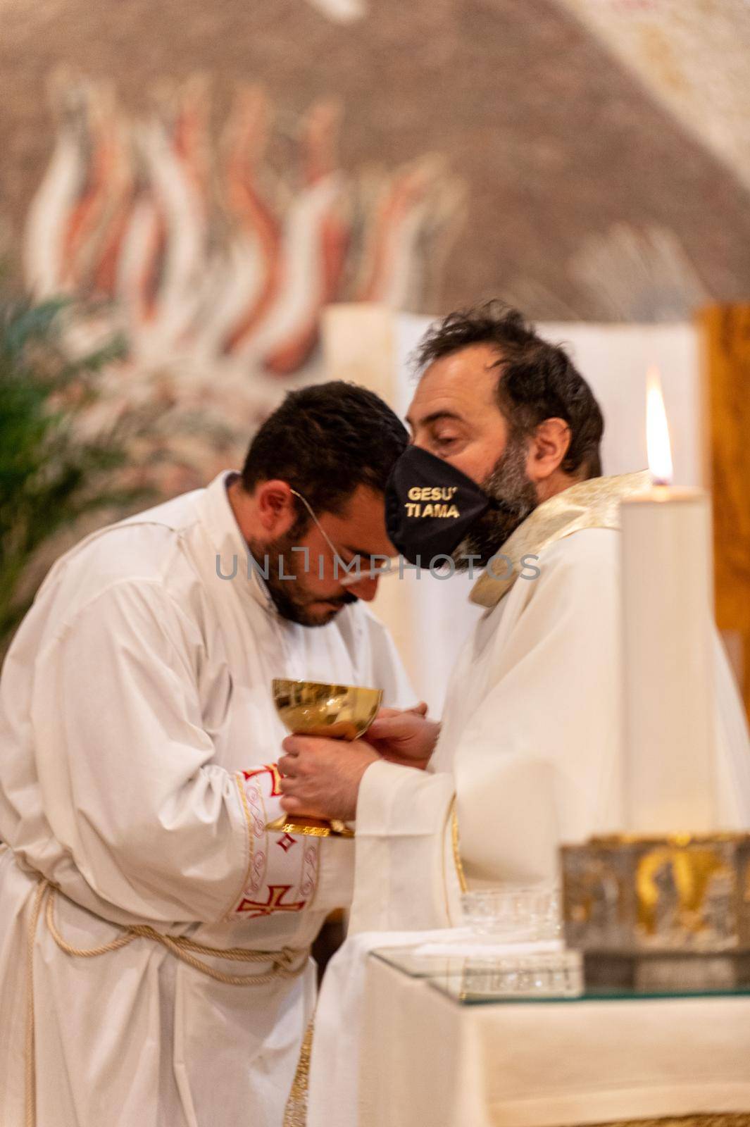 priests during the holy mass in the church of sacro cuore terni by carfedeph