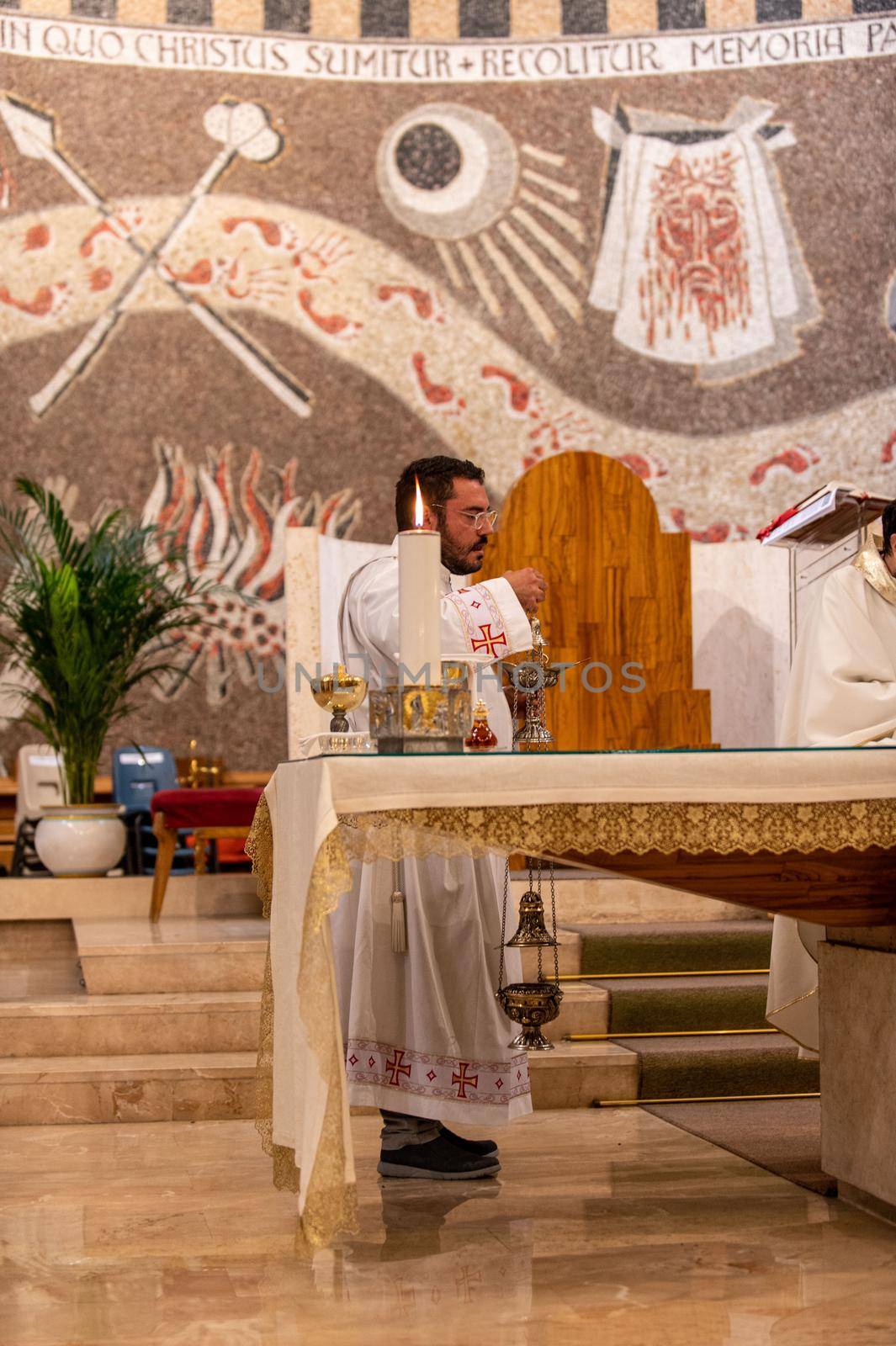 terni,italy may 21 2021:priests during the holy mass in the church of sacro cuore terni