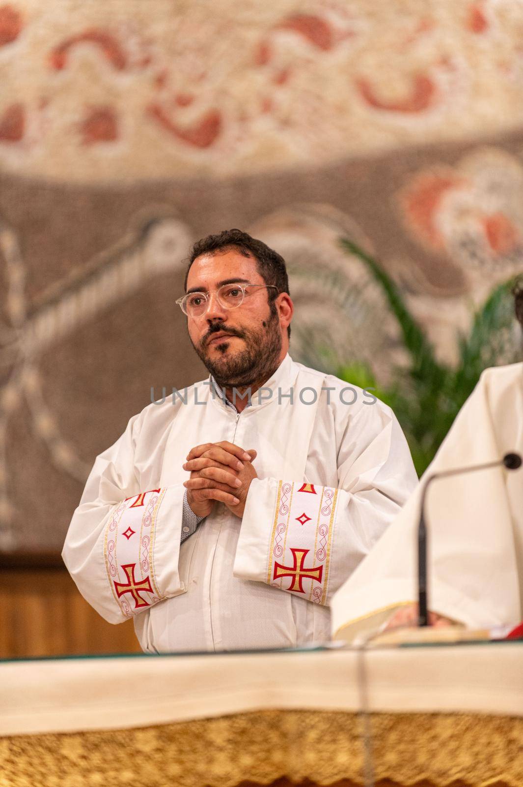 priests during the holy mass in the church of sacro cuore terni by carfedeph