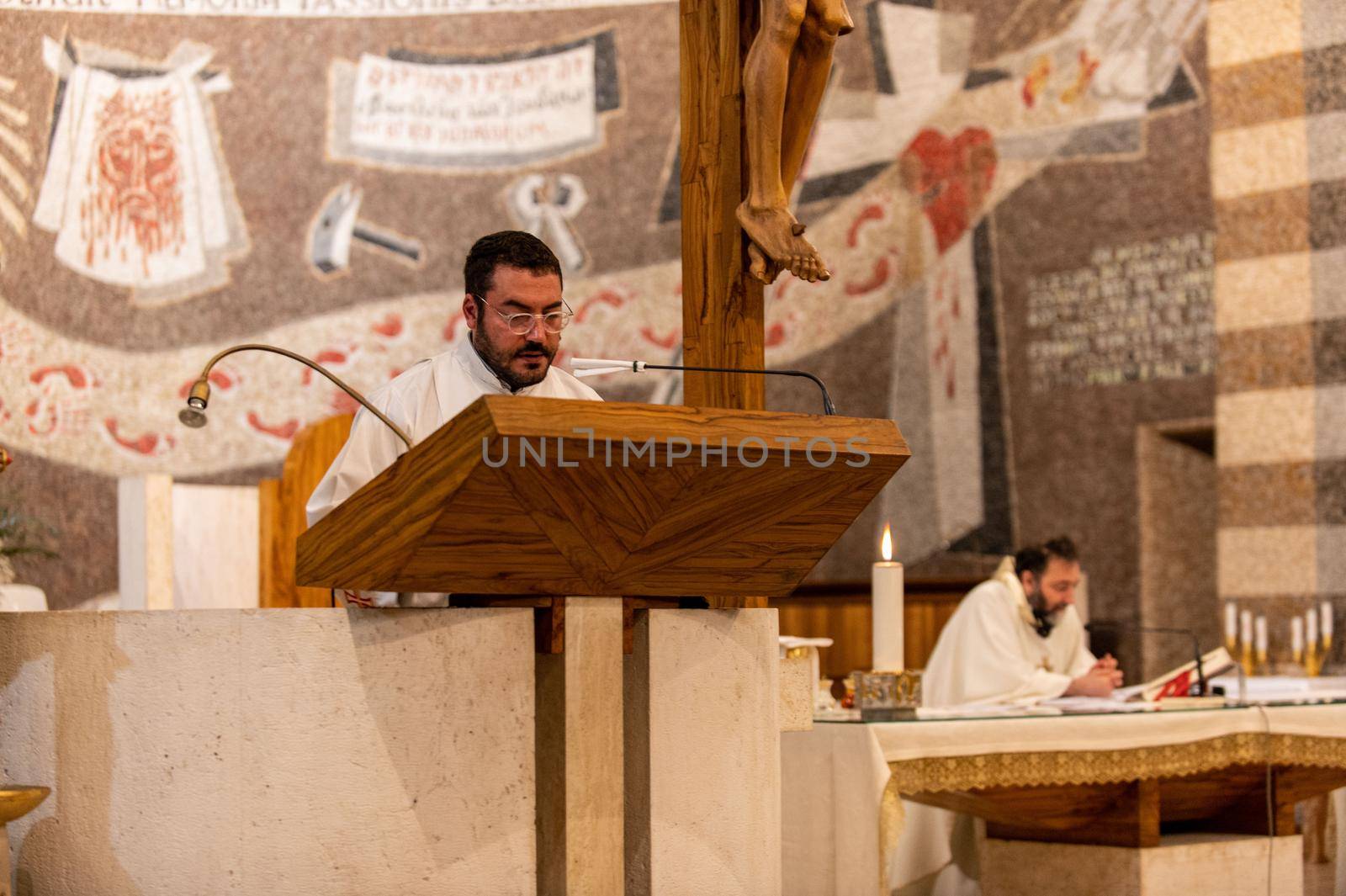 terni,italy may 21 2021:priests during the holy mass in the church of sacro cuore terni