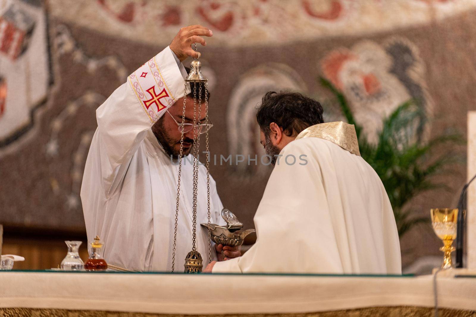 priests during the holy mass in the church of sacro cuore terni by carfedeph