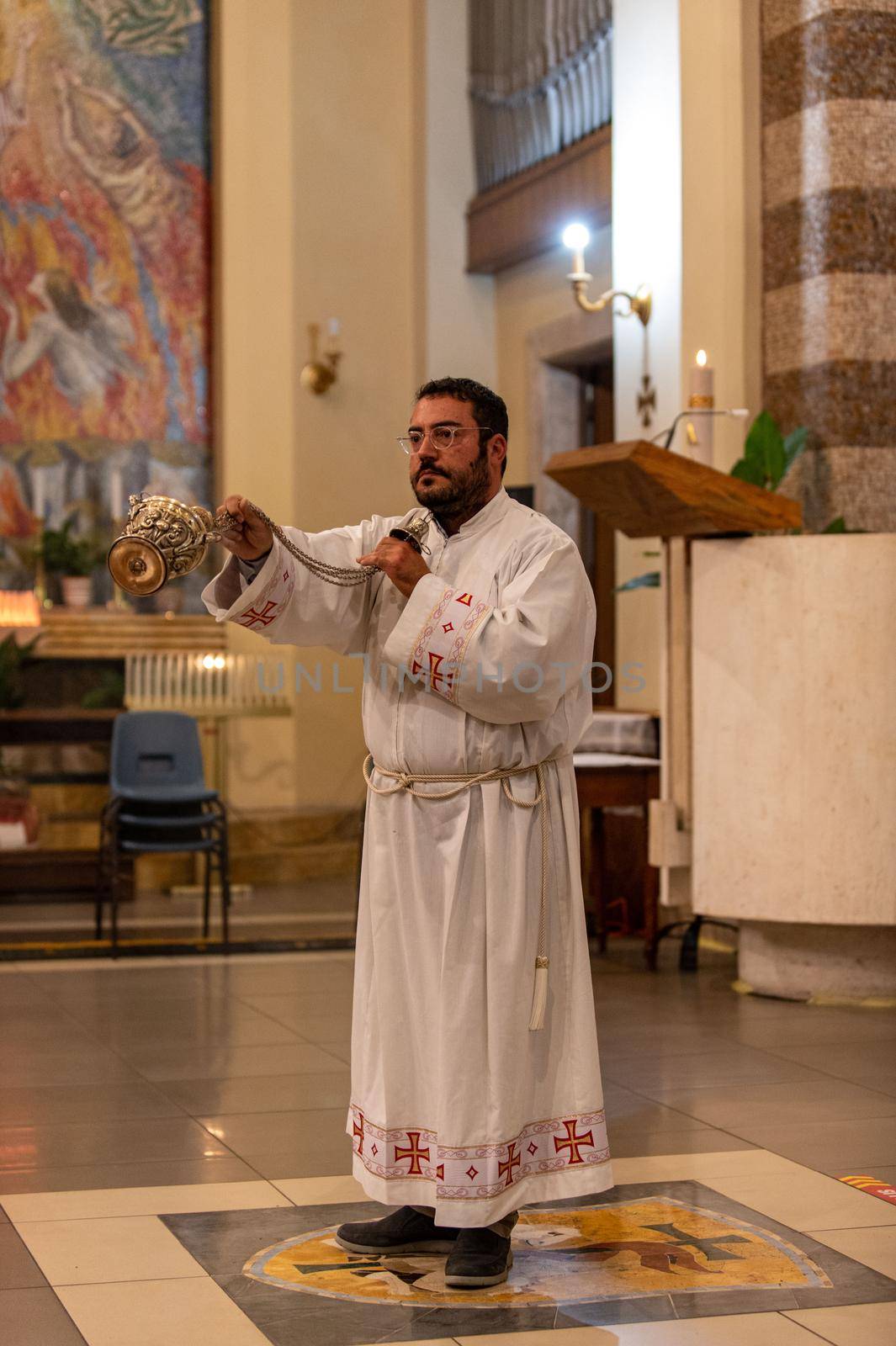 priests during the holy mass in the church of sacro cuore terni by carfedeph