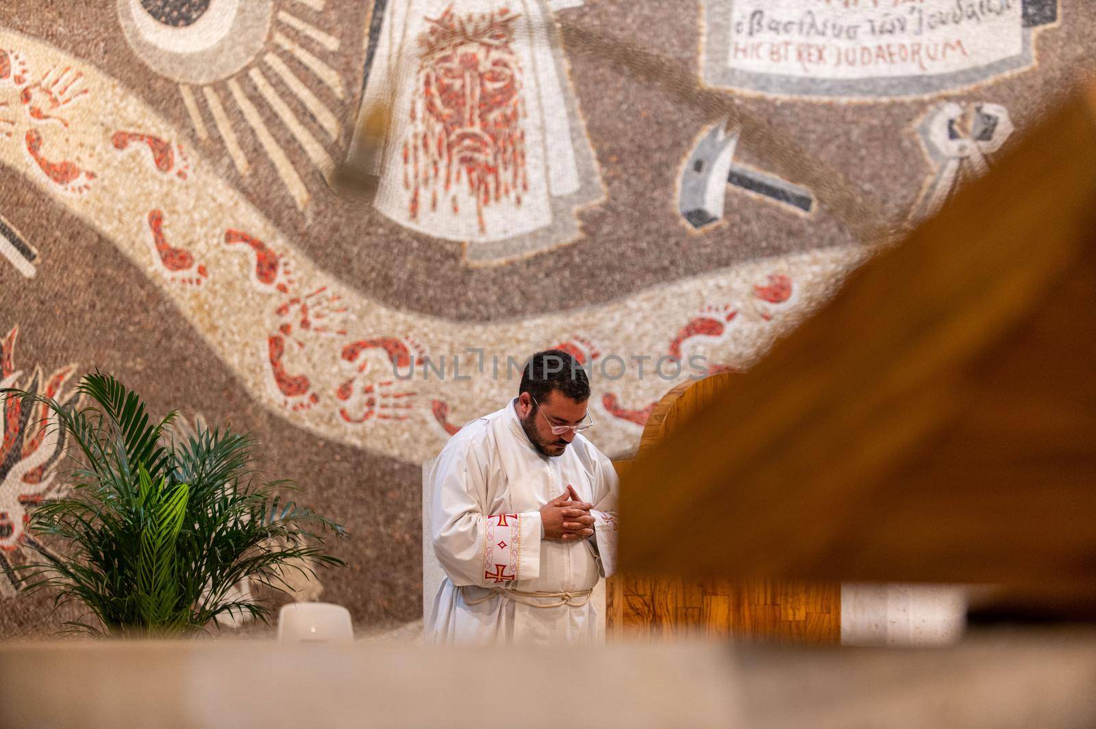 terni,italy may 21 2021:priests during the holy mass in the church of sacro cuore terni