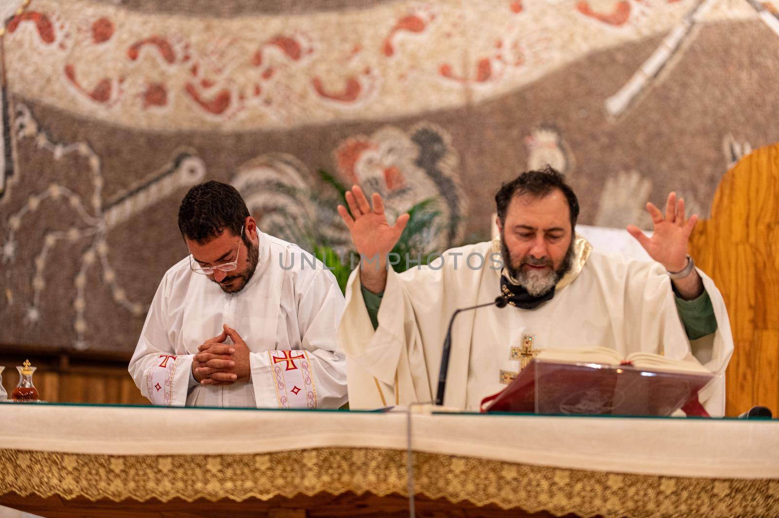 priests during the holy mass in the church of sacro cuore terni by carfedeph