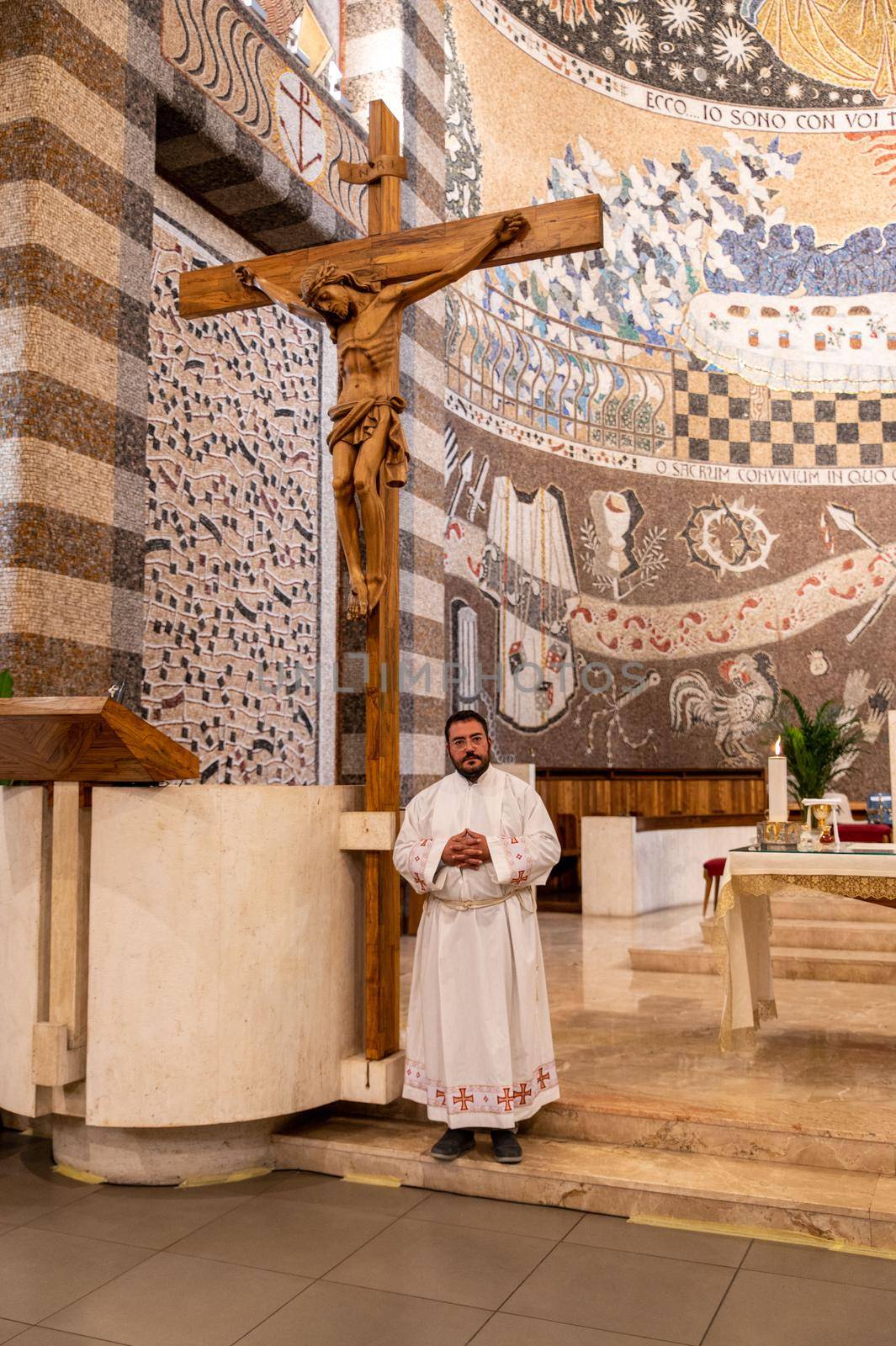 priests during the holy mass in the church of sacro cuore terni by carfedeph