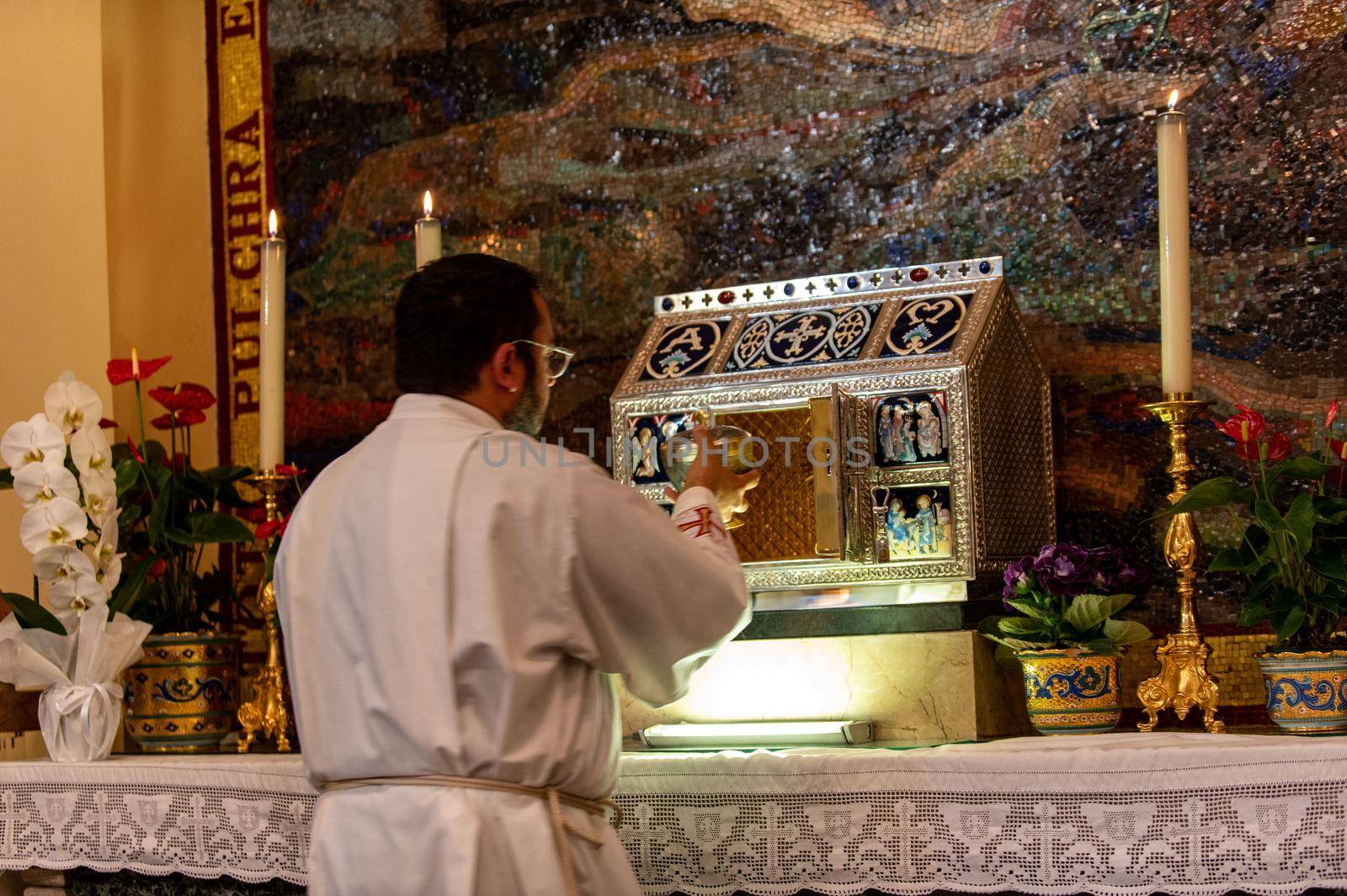 priests during the holy mass in the church of sacro cuore terni by carfedeph