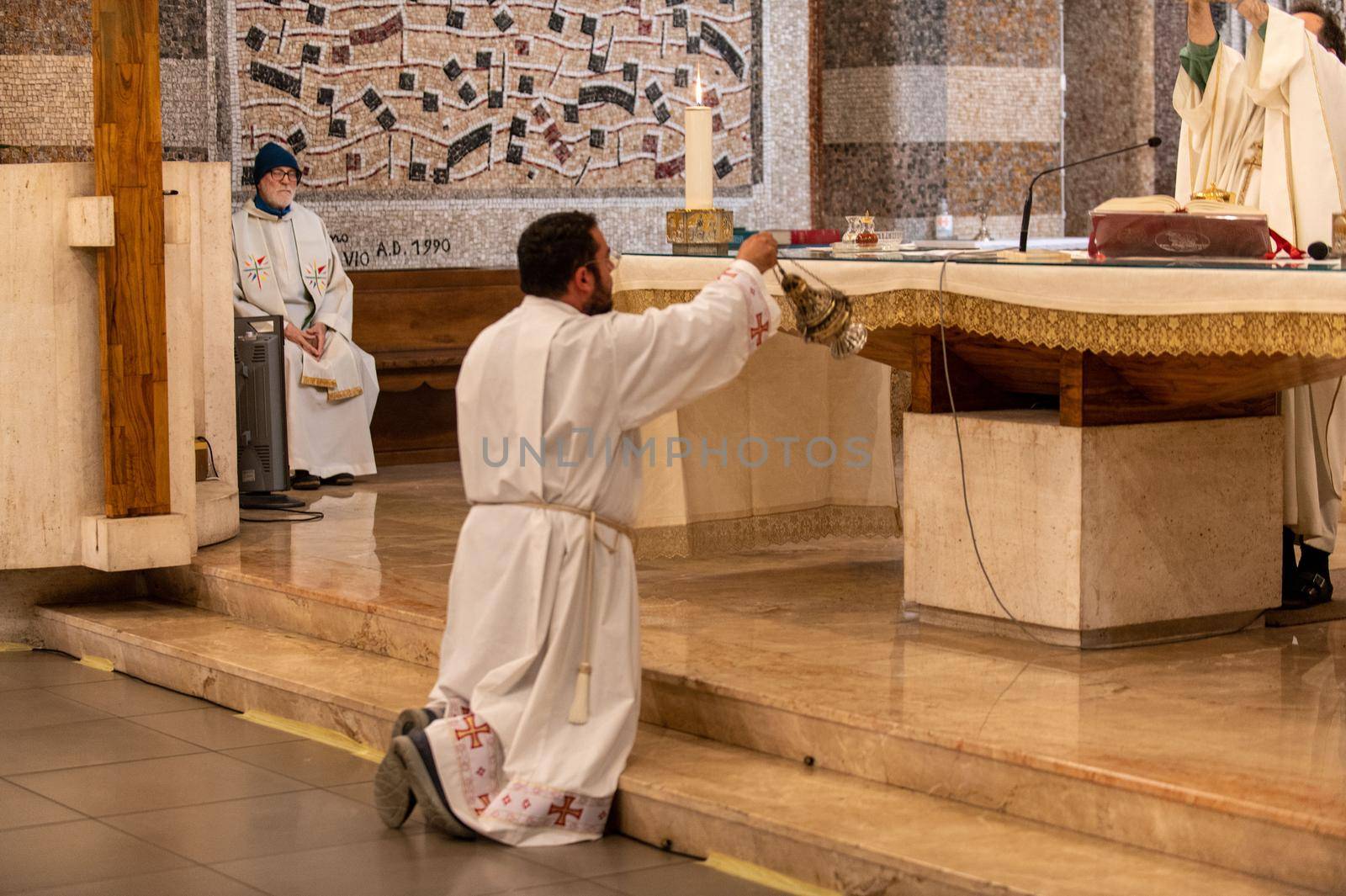 priests during the holy mass in the church of sacro cuore terni by carfedeph