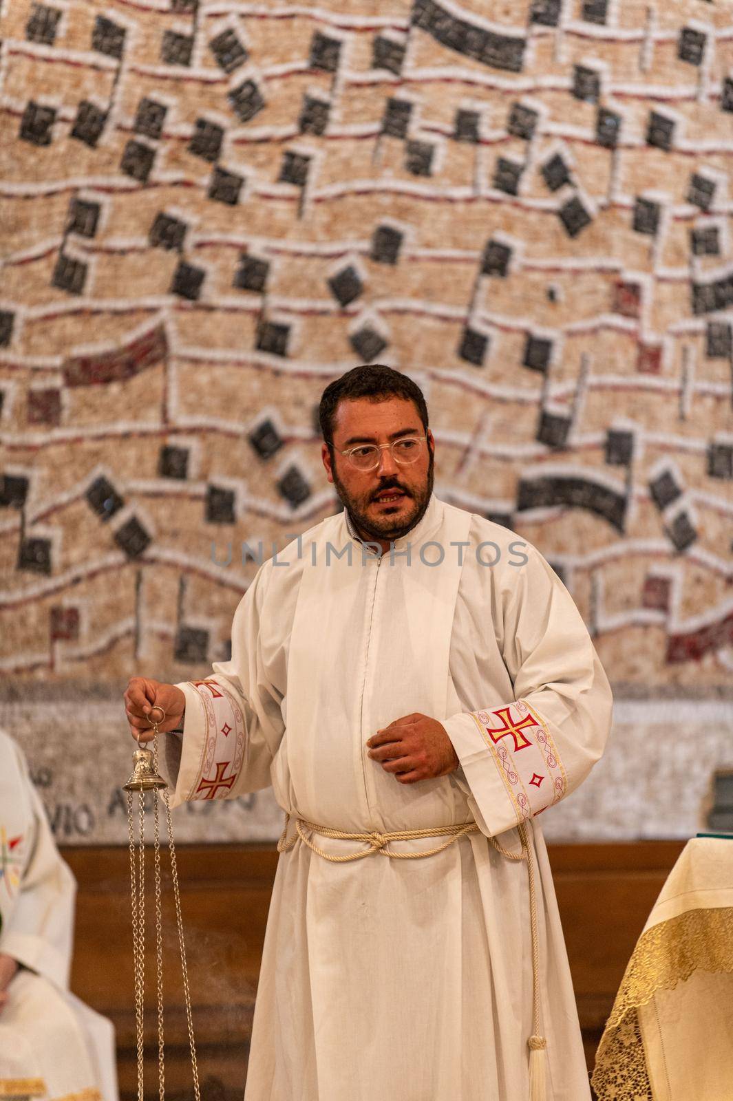 priests during the holy mass in the church of sacro cuore terni by carfedeph