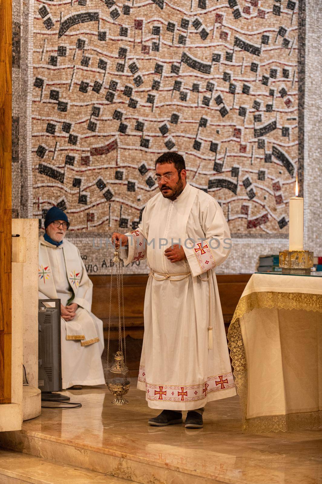 priests during the holy mass in the church of sacro cuore terni by carfedeph