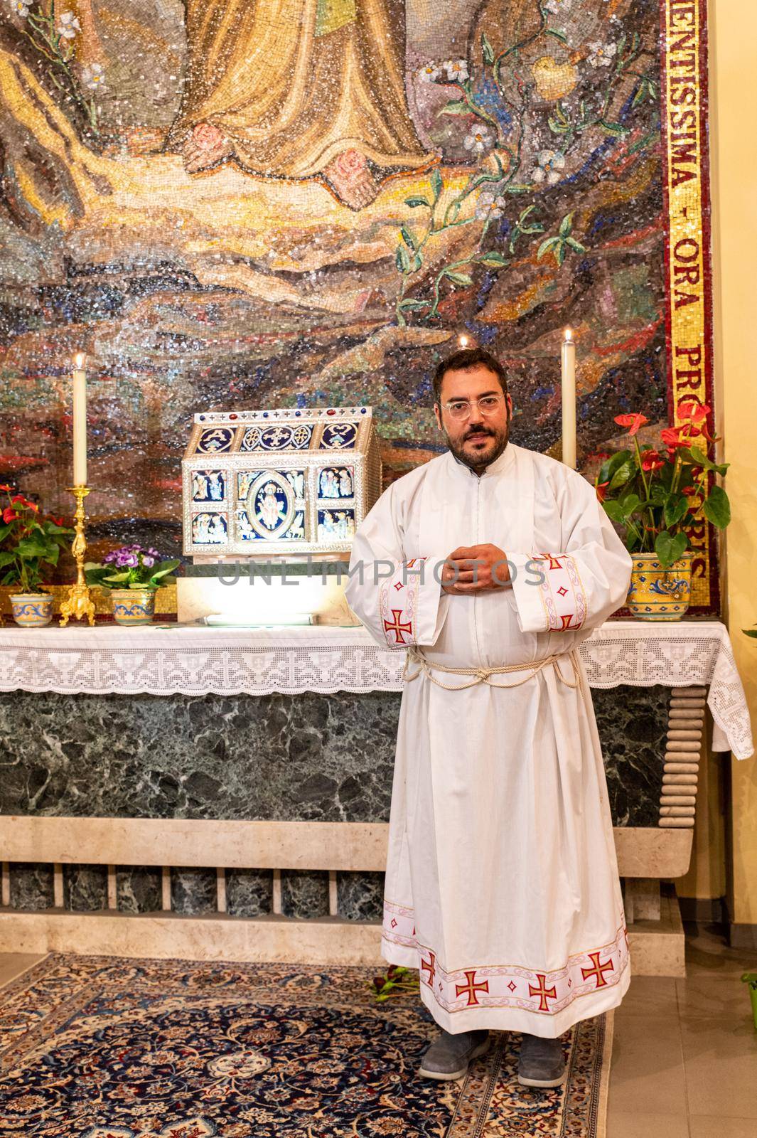 priests during the holy mass in the church of sacro cuore terni by carfedeph