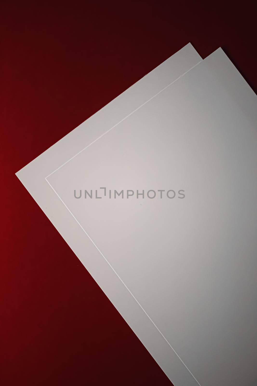 Blank A4 paper, white on red background as office stationery flatlay, luxury branding flat lay and brand identity design for mockup.