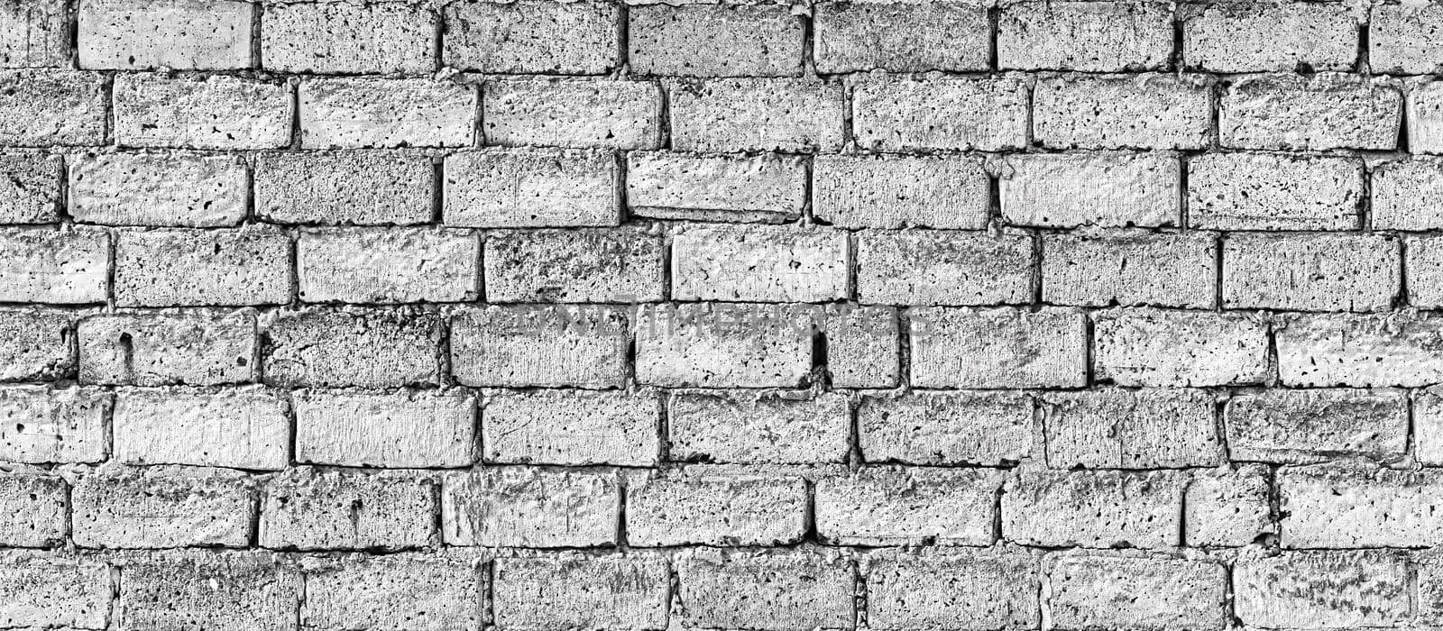 Wall texture from white old damaged bricks. Abstract background for design.