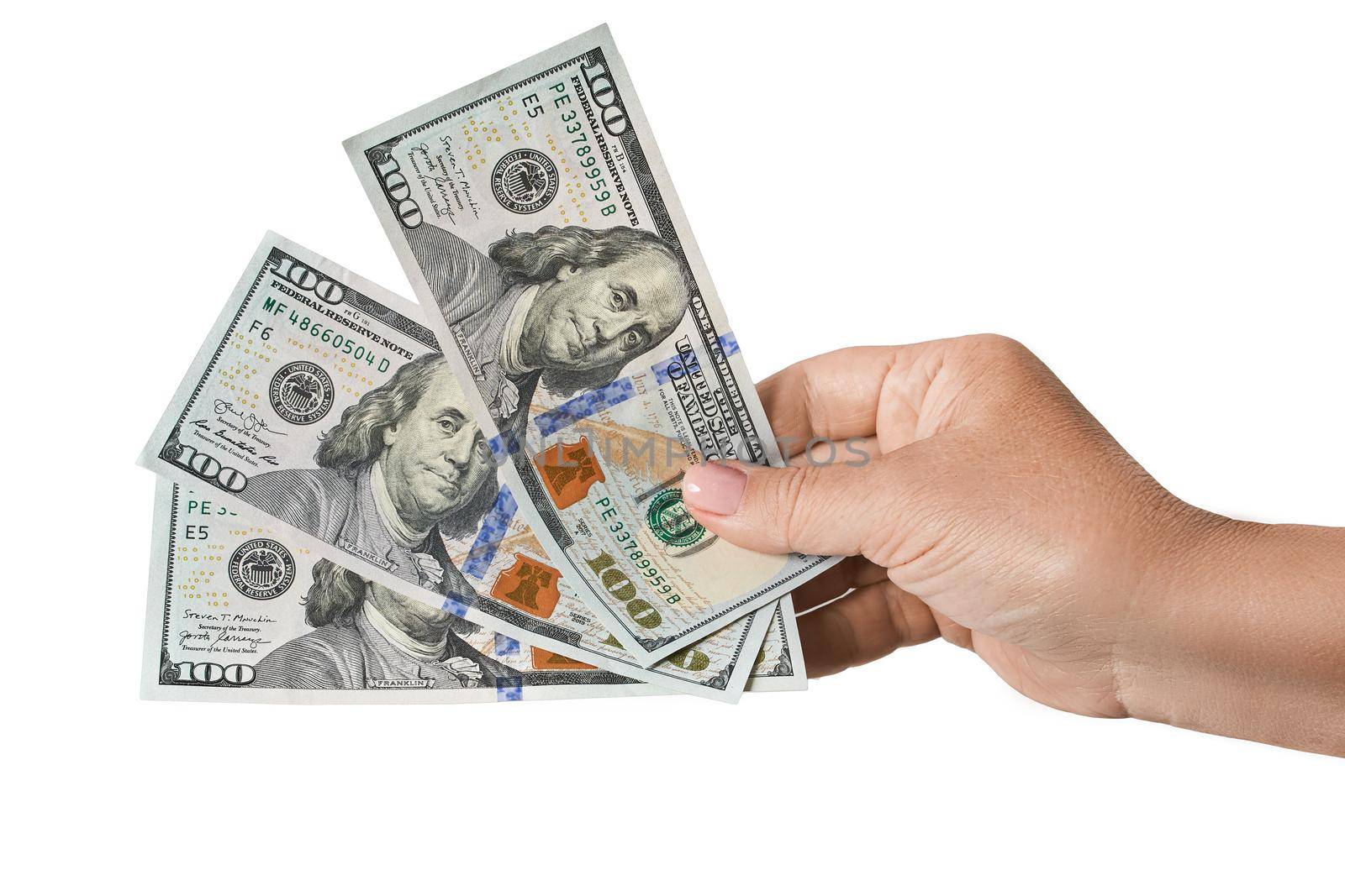 Woman's hand holds three bills 100 American dollar bill cash money isolated on white background. US Dollars 100 banknote