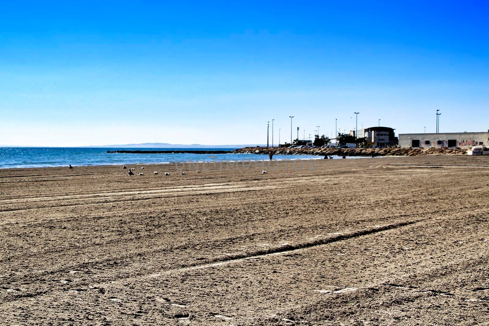 Sunny day on the beach in winter in Santa Pola, Alicante