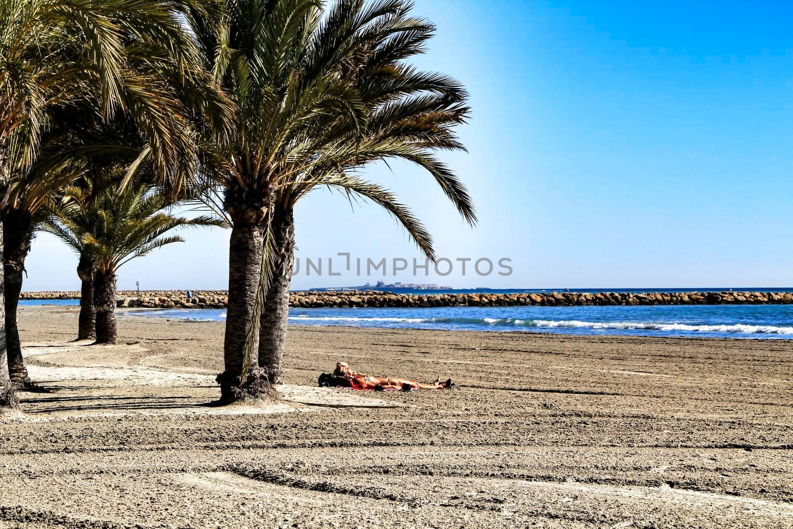 Sunny day on the beach in winter in Santa Pola, Alicante
