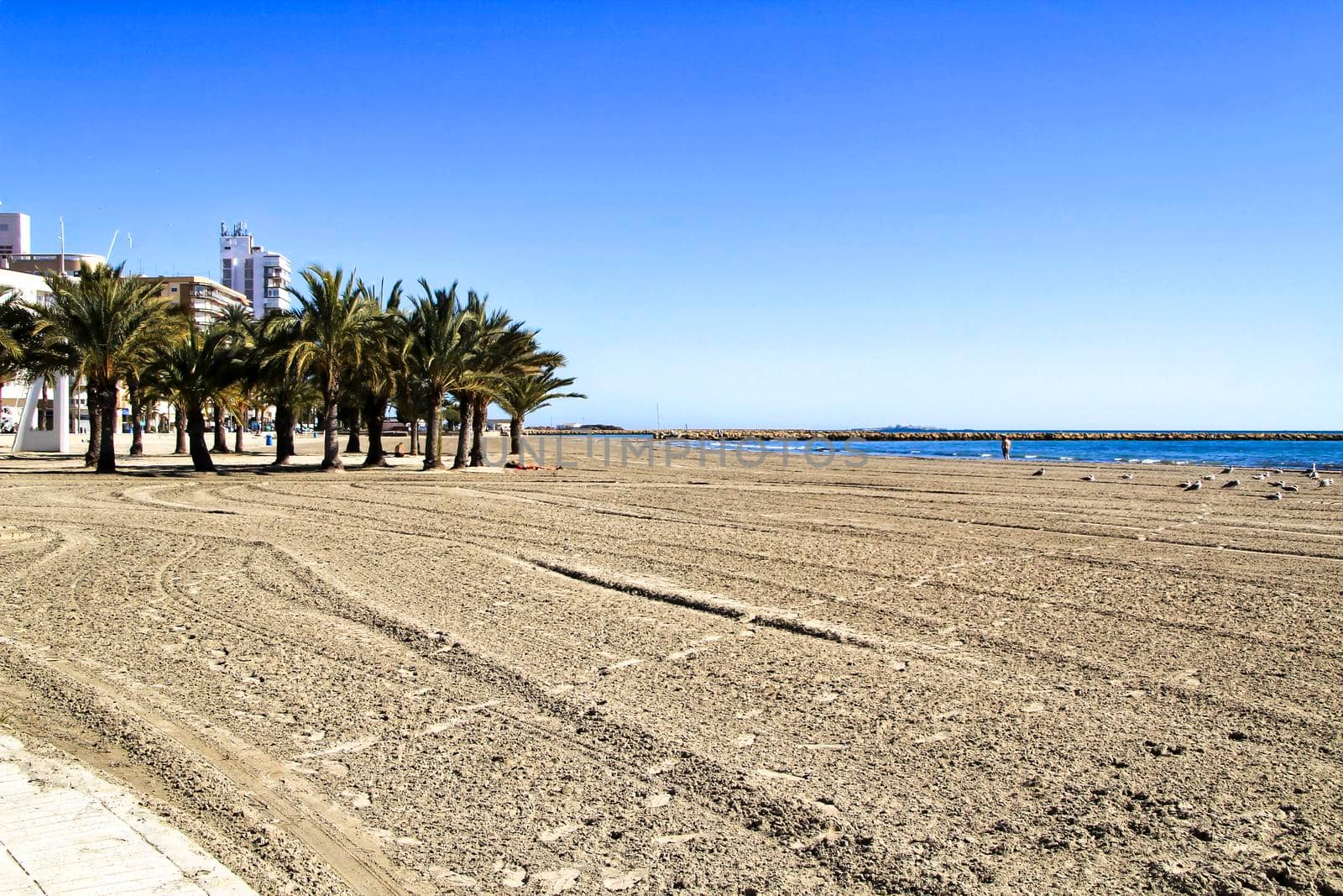 Sunny day on the beach in winter in Santa Pola, Alicante