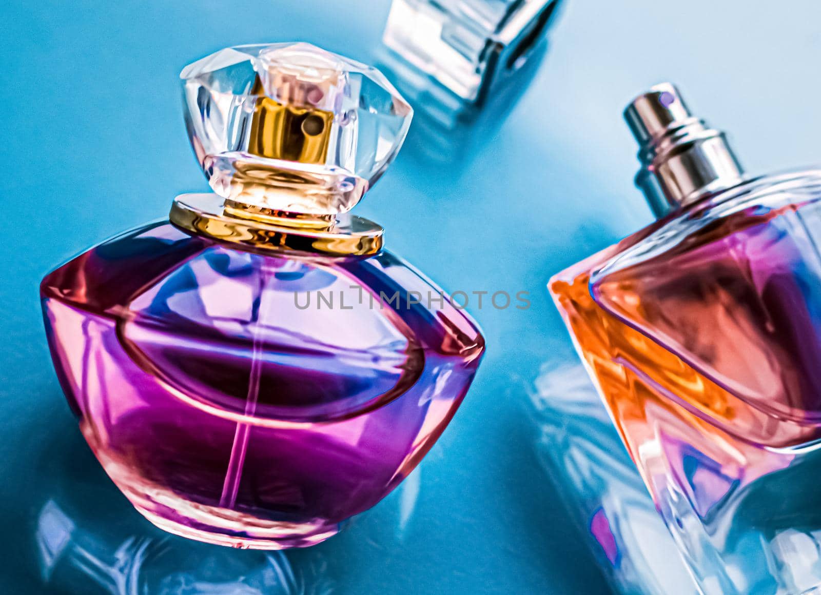 Perfume bottle on glossy background, sweet floral scent, glamour fragrance and eau de parfum as holiday gift and luxury beauty cosmetics brand design.