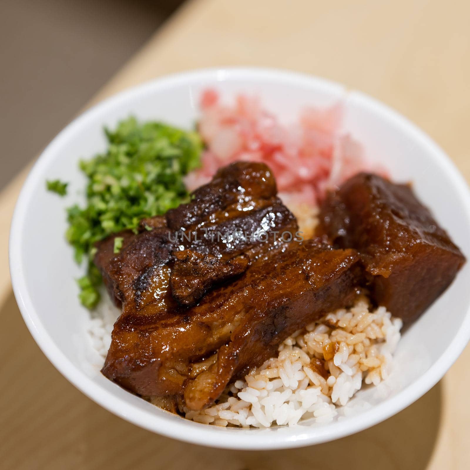 Japanese food, Gyudon - a bowl of rice with sliced beef by uphotopia