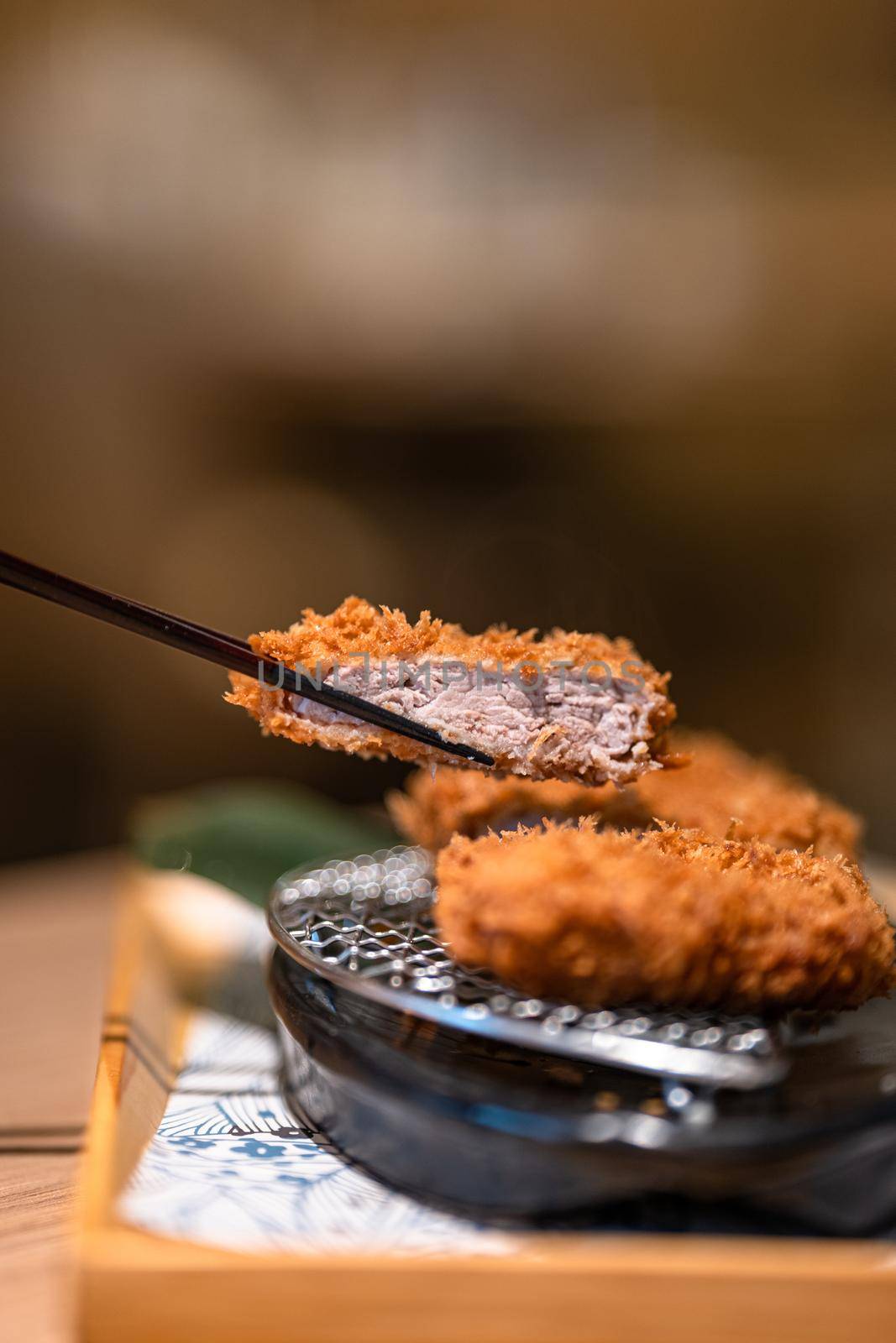 Macro shot of Japanese pork cutlet by uphotopia