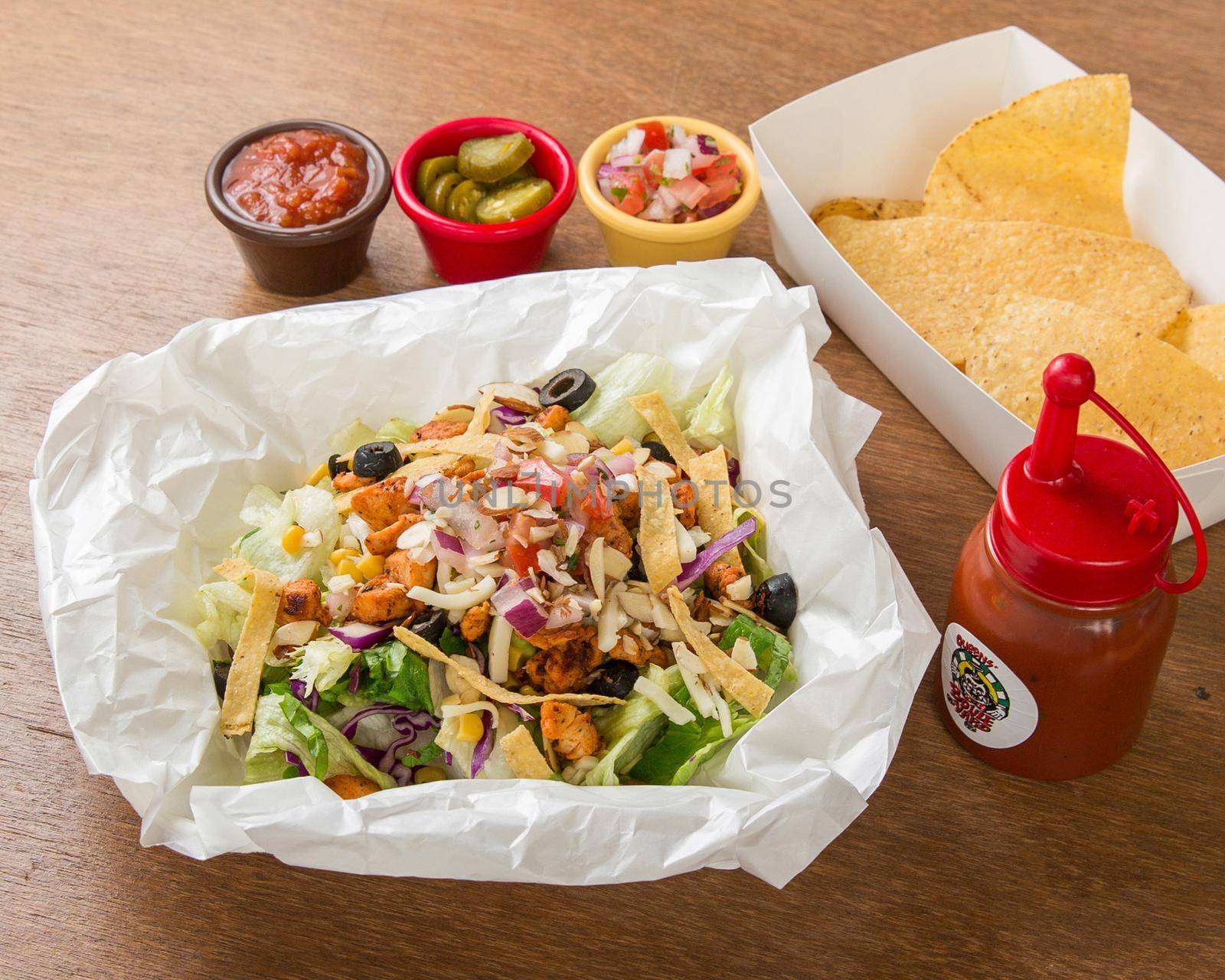 Mix of Mexican food on restaurant table by uphotopia