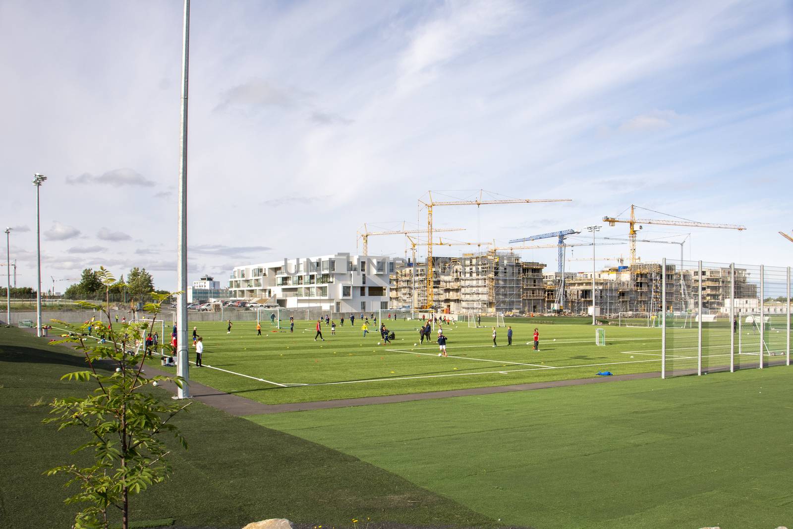 soccer sports field with kids training for football in Reykjavik, Iceland by kb79
