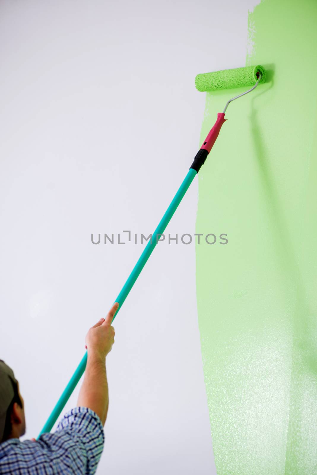 Young painter doing renovation at home 
