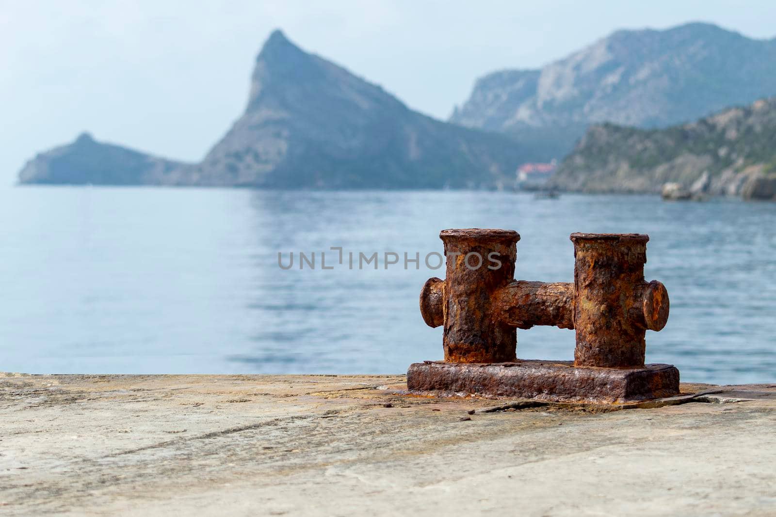 Knechts on pier against backdrop of sea and mountains. by Essffes