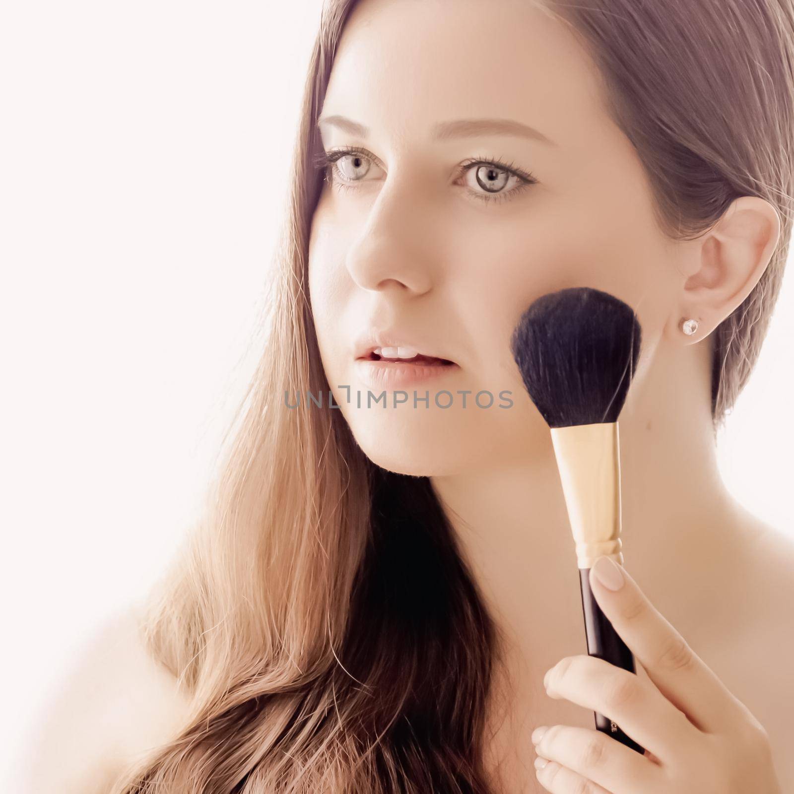 Beautiful woman with makeup brush, perfect skin and shiny hair as make-up, health and wellness concept. Face portrait of young female model for skincare cosmetics and luxury beauty ad design by Anneleven