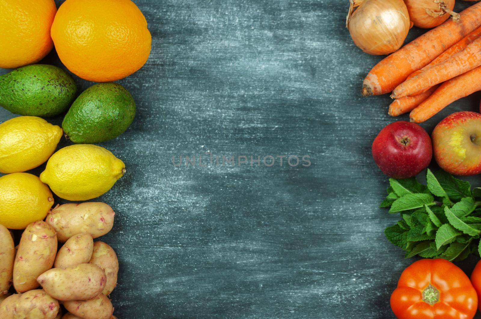 Flat lay of multi-colored raw vegetables on a black background, food frame. Local products for healthy cooking. Eco-friendly products. Clean food. Top view. Copy space.