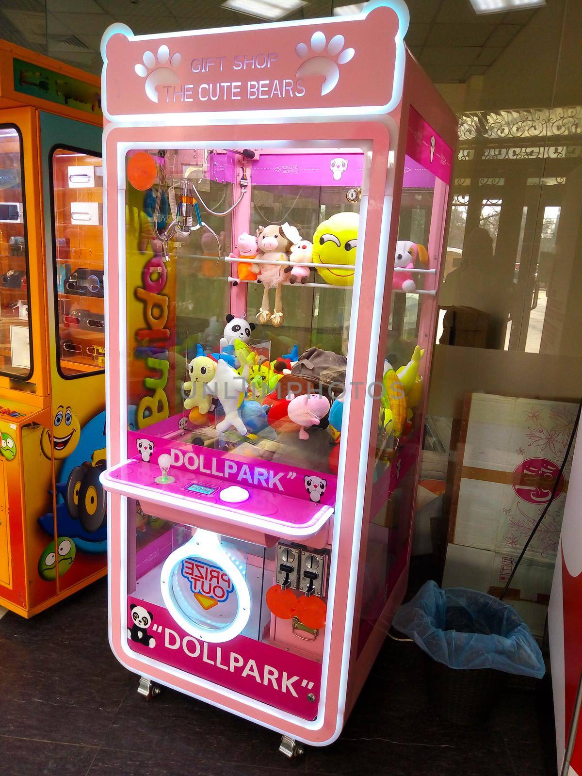 Russia Yaroslavl 21.02.2021 Pink slot machine with toys prizes in the children's center.