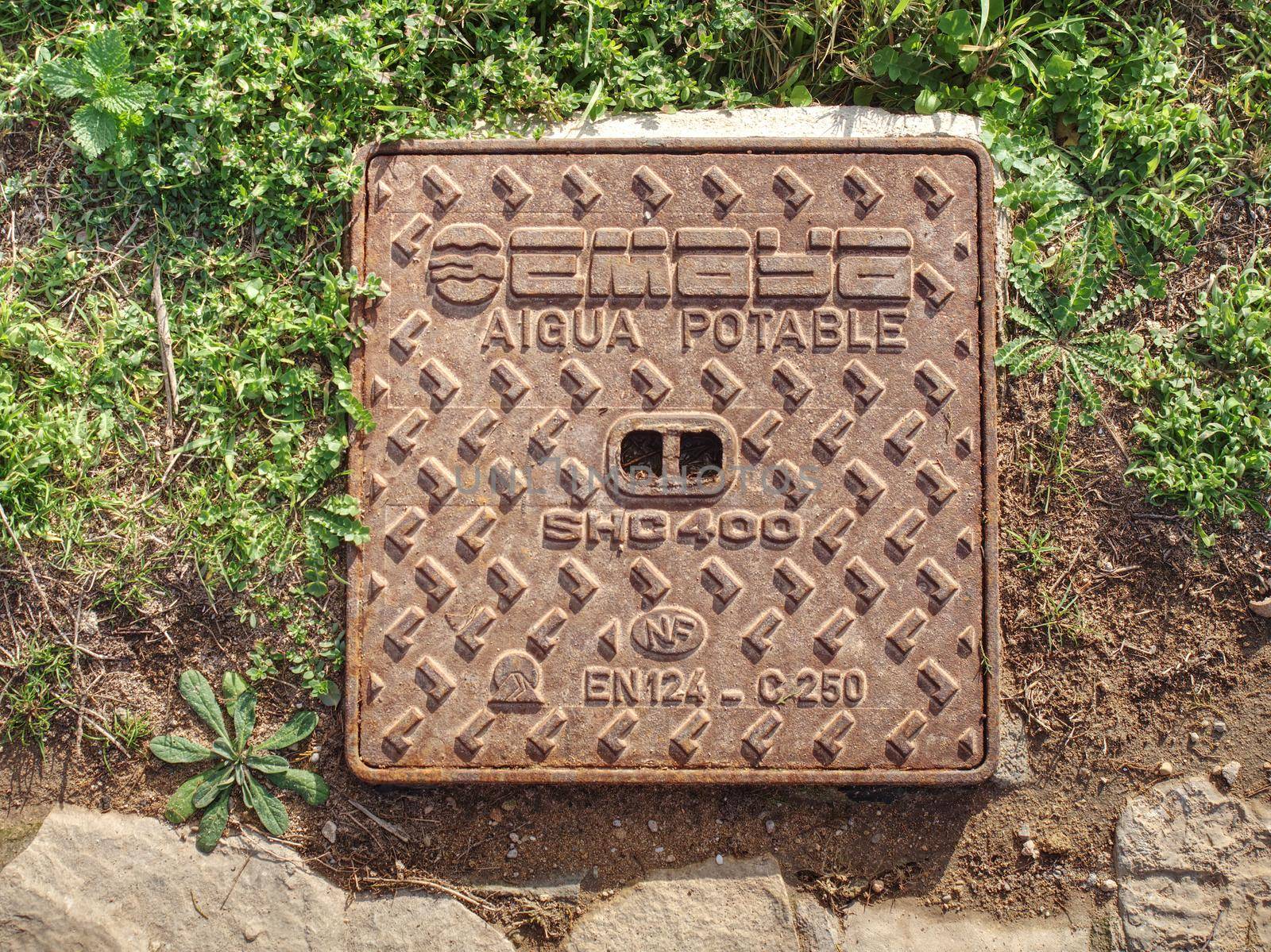 Shafts for drink water system. Manhole cover lid square concrete steel cap. Aigua Potable - Potable Water.  Promenade  at Palma de Mallorca city, 26thof January 2020