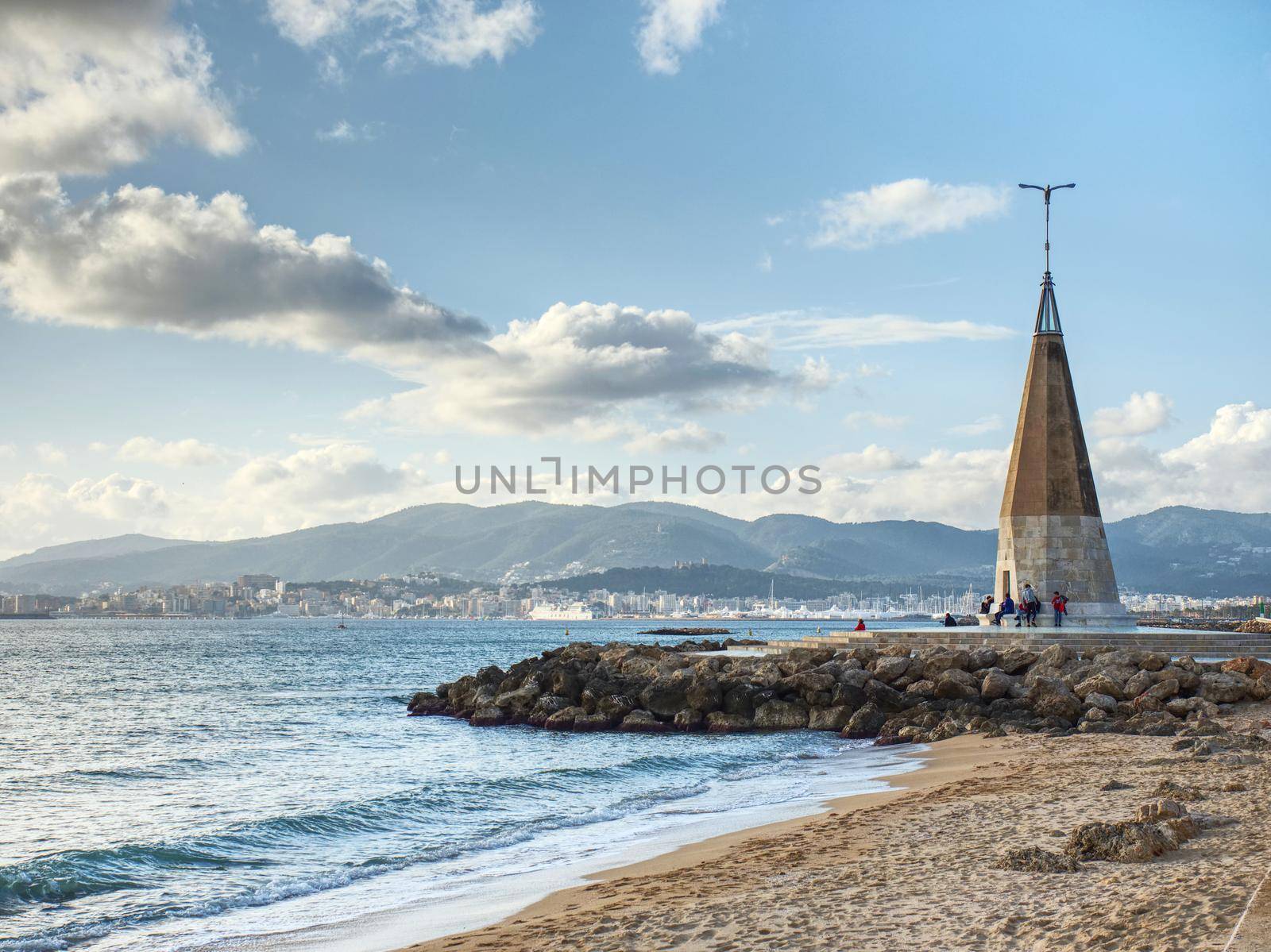 Seagull monument with blue shinning peak. Well known meeting place at seaside promenade. Palma city, Mallorka island, Spain. 26th of January 2020