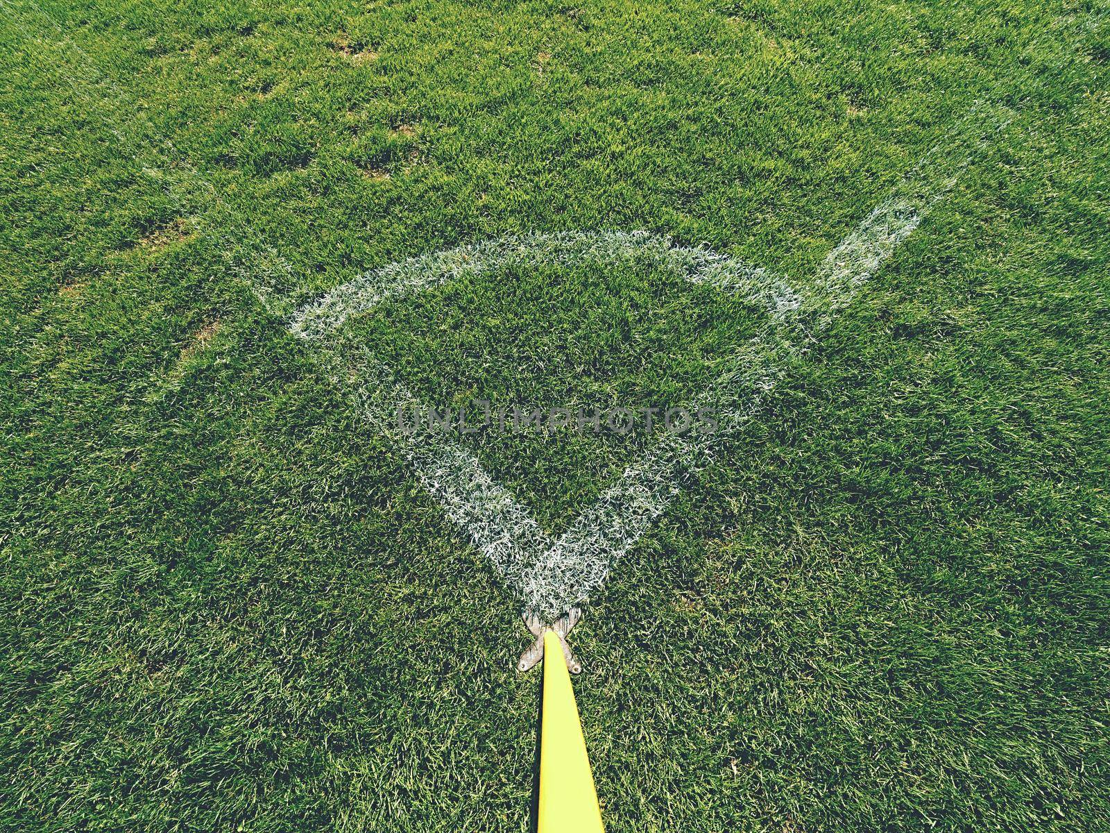 Football field corner detail with white marks and flag stick