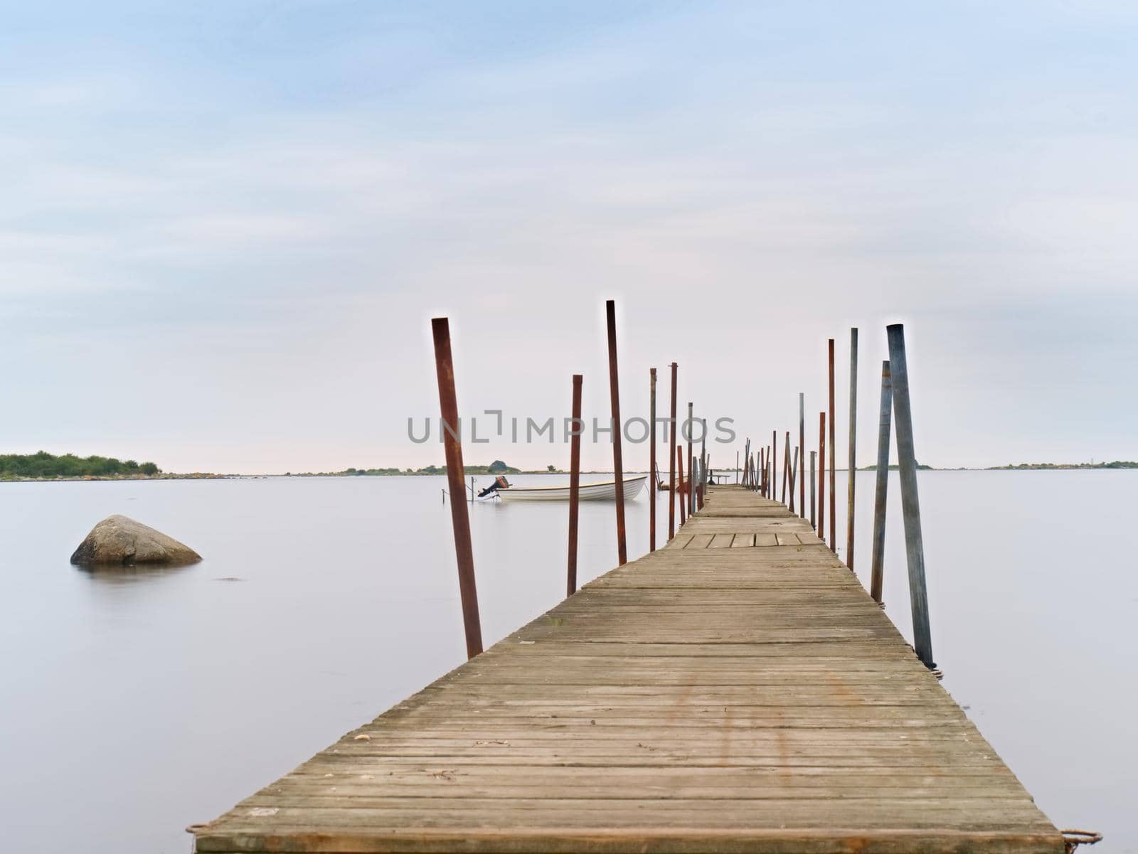 Swimming ladder from stainless steel for descent into sea water on pier. Silent bay ideal for children swim and play