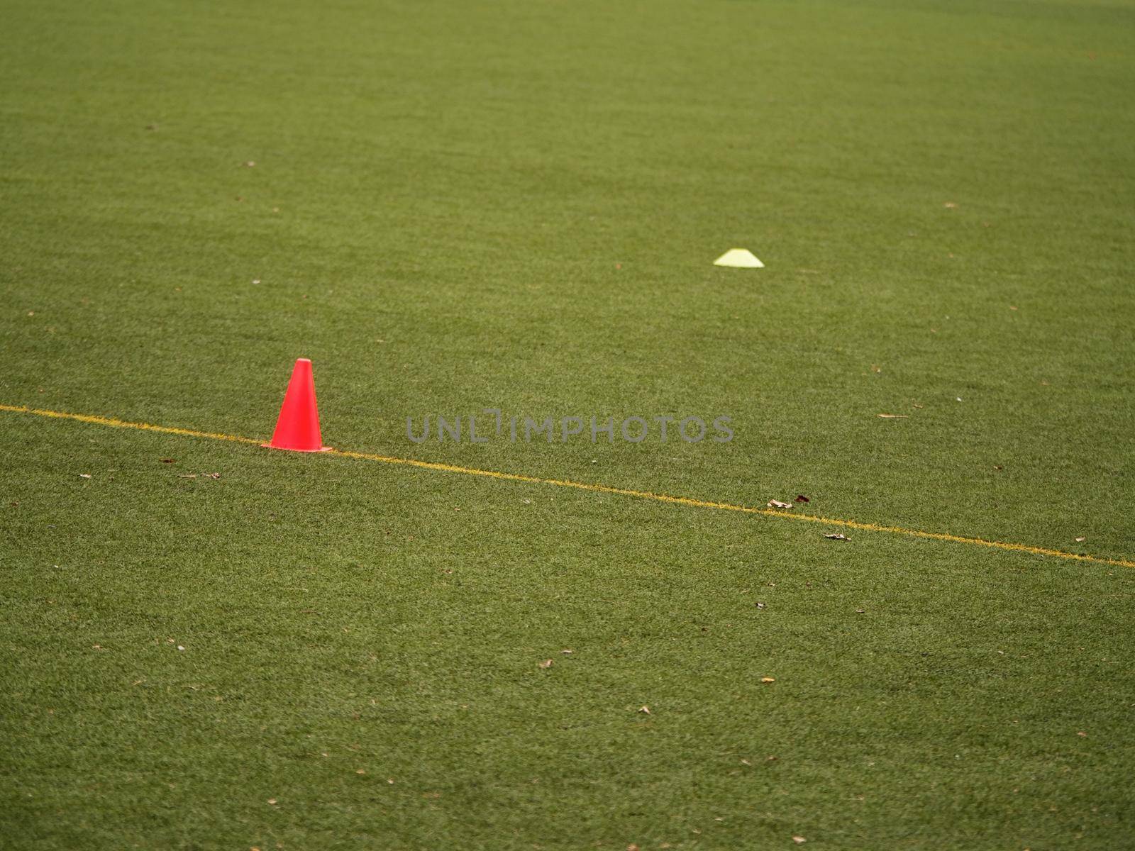 The plastic cones on turf football or soccer green field, Training equipment. Soccer Football Training Session, Training Football