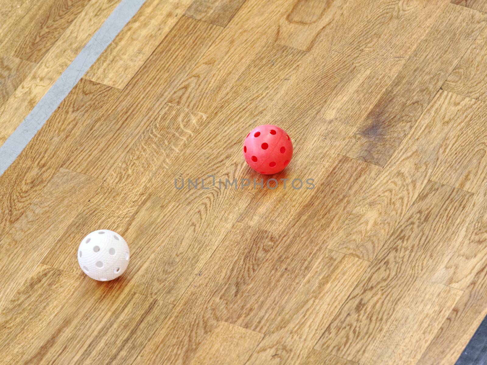Floor-ball court. Painted wooden floor of sports hall with colorful marking lines. Schooll gym hall